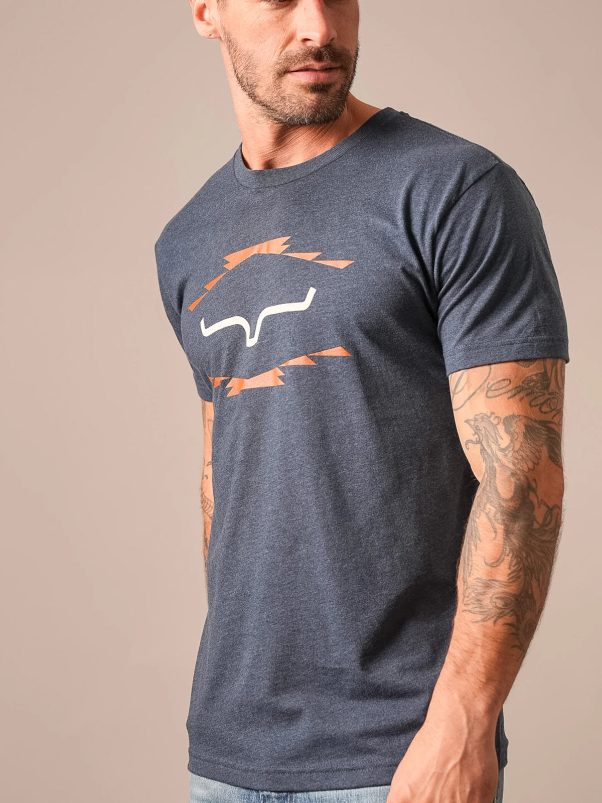 Kimes Ranch Vintage Badge shirt in Midnight Navy, side view, with a stylized steer logo and orange lightning bolts
