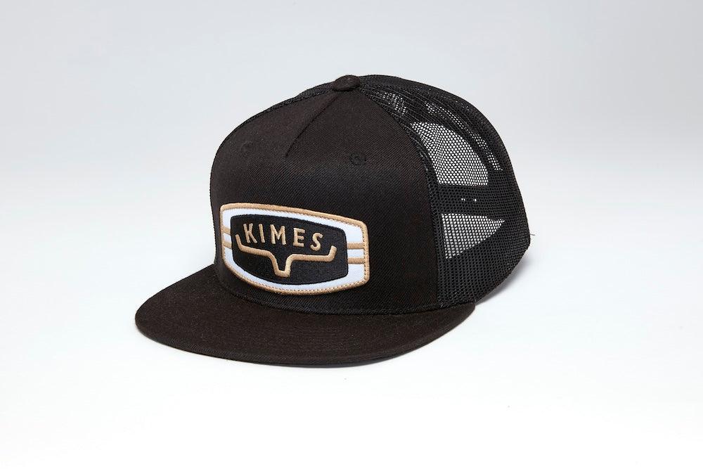 Kimes Ranch Craftsman, side view, Black trucker hat with a flat brim and embroidered logo patch