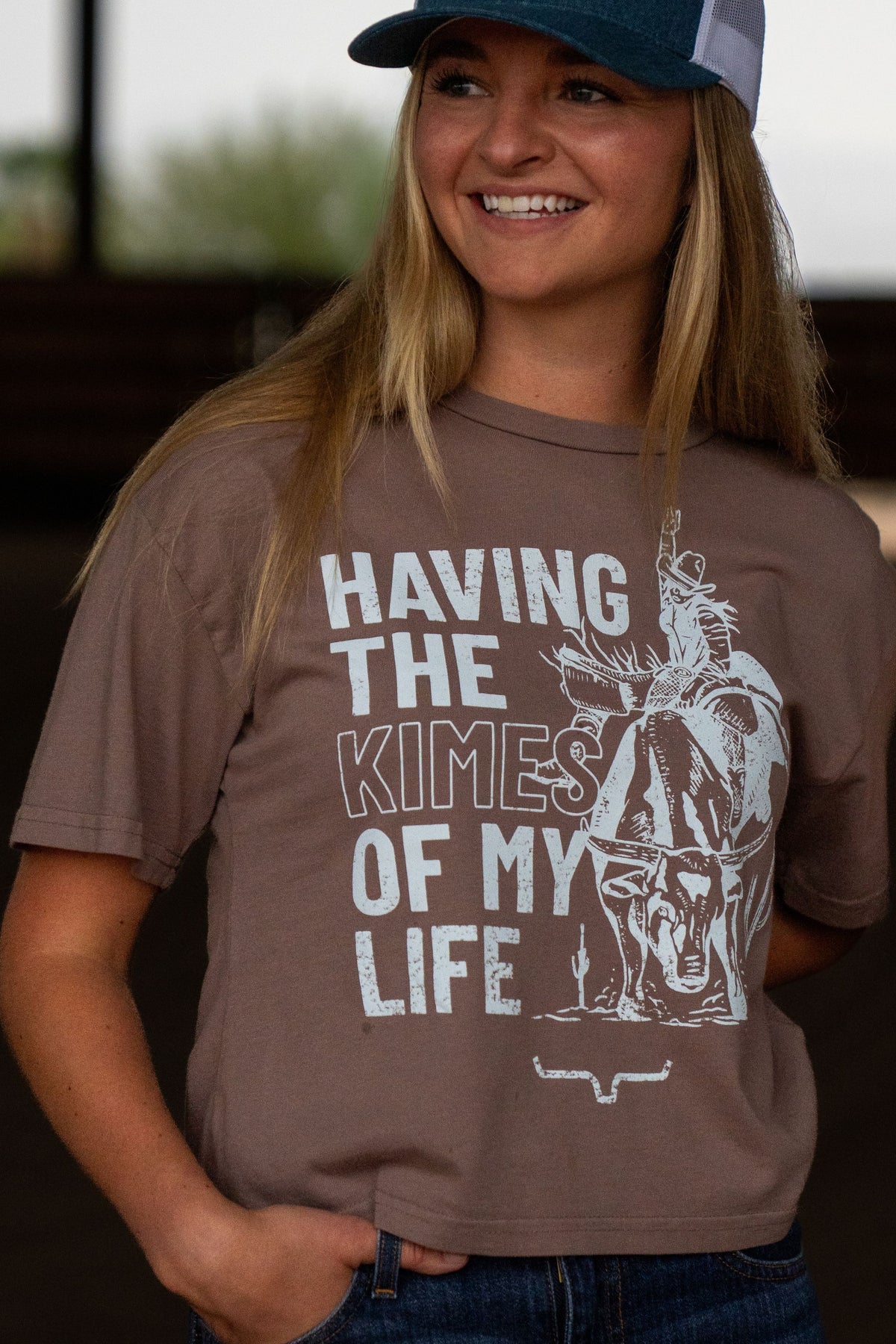 Kimes Ranch Kimes Of My Life shirt in Mocha with a white graphic of a cowboy on a steer