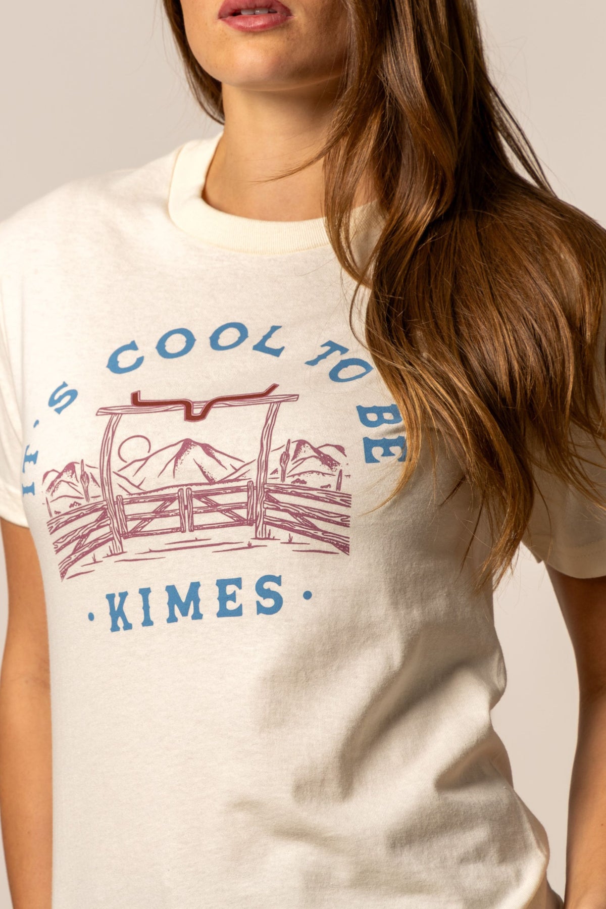 Kimes Ranch It's Cool to be Kimes shirt with a graphic of a ranch gate and mountains with the text It's Cool to be Kimes