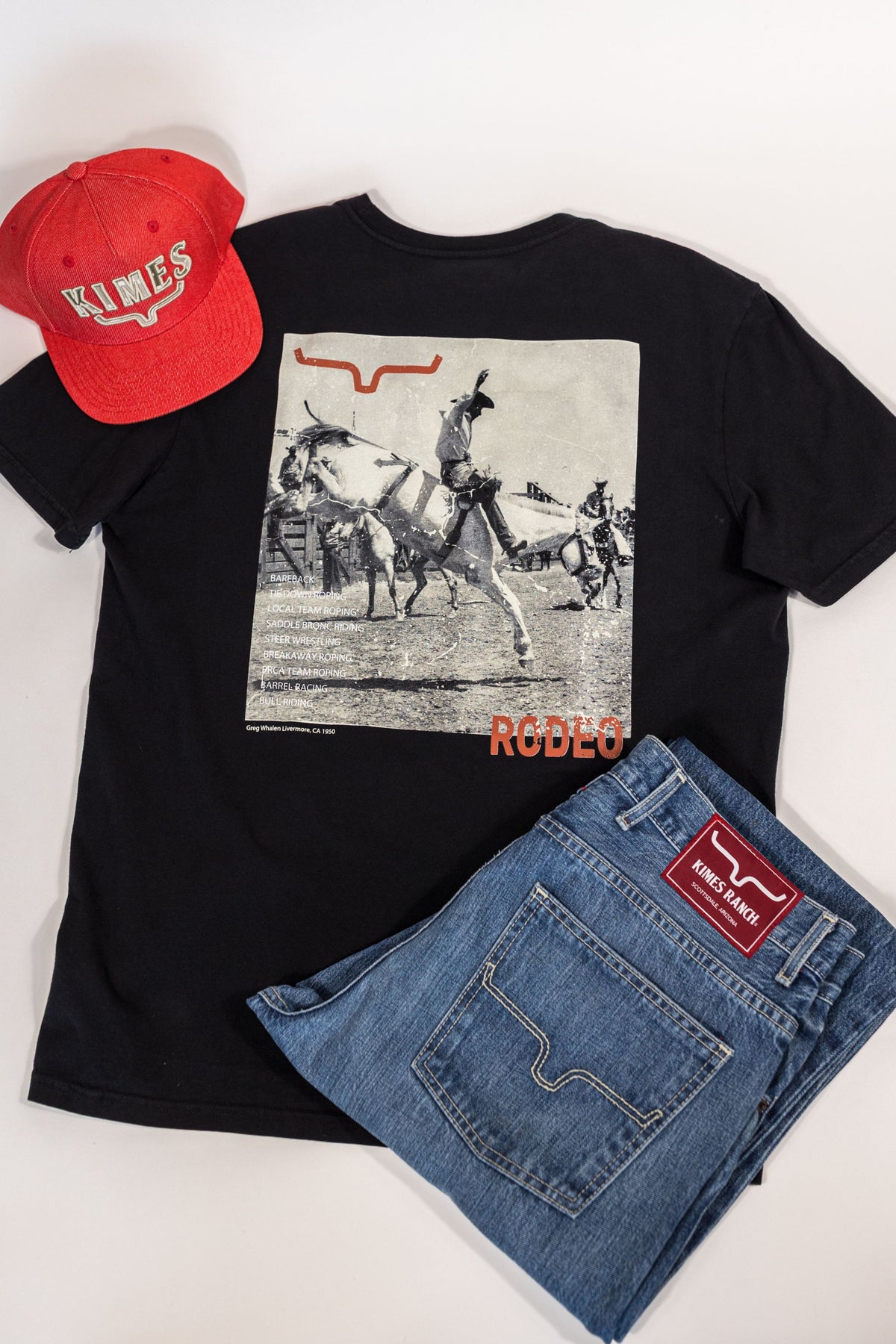 Kimes Ranch Not Our First, back view, Black shirt with a rodeo graphic and RODEEO text