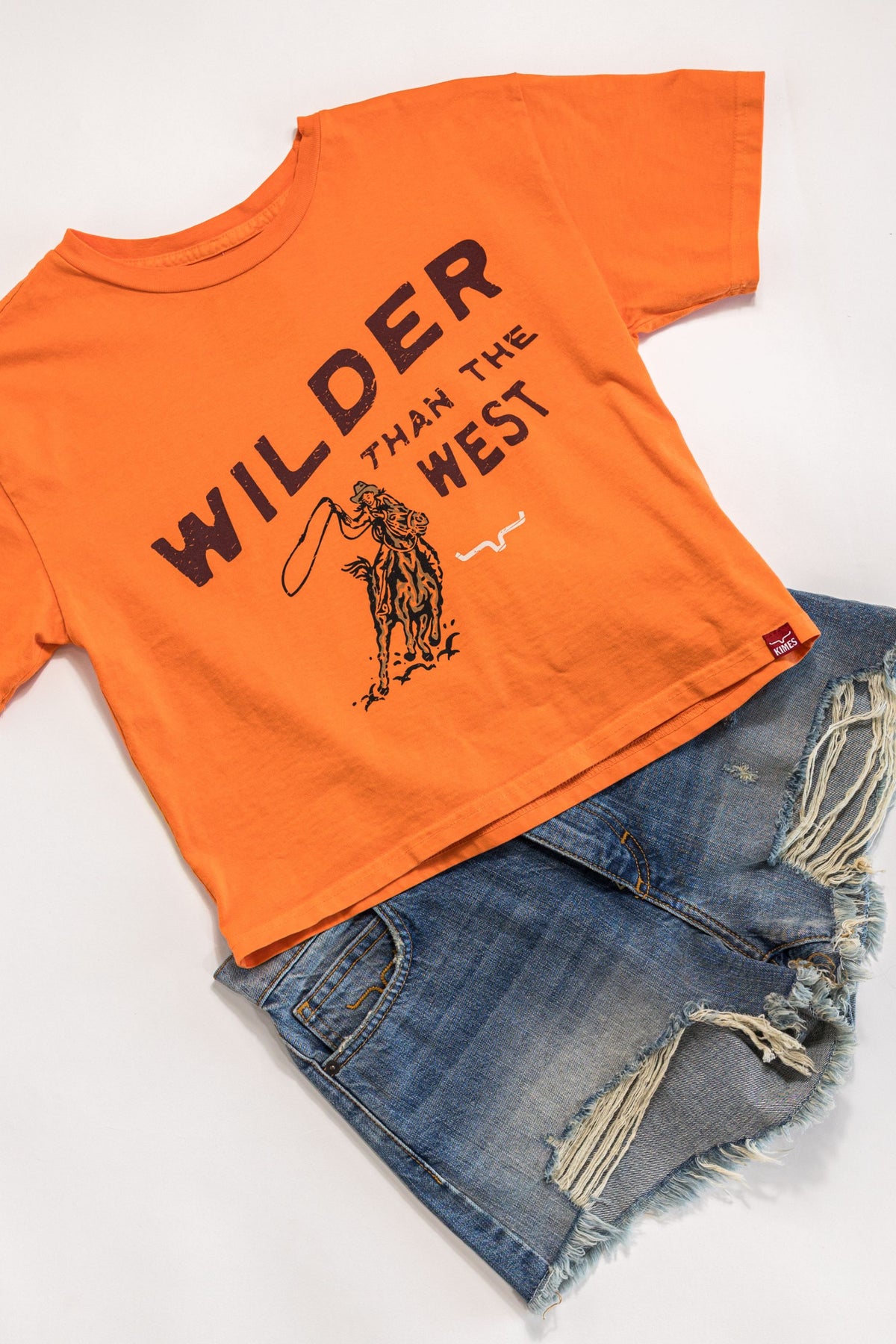 Kimes Ranch Wilder Than The West shirt in Vintage Orange with a cowboy graphic and text