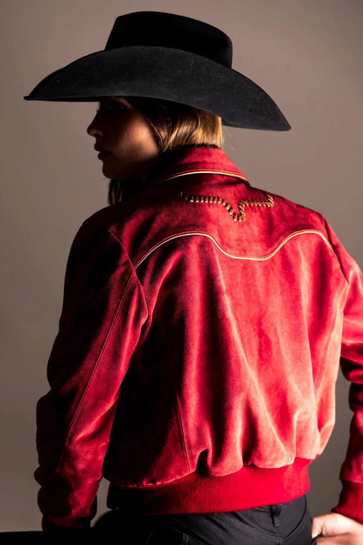 Kimes Ranch KR x Western & Co. Bomber Jacket, back view, in red with gold yoke stitching and ribbed hem