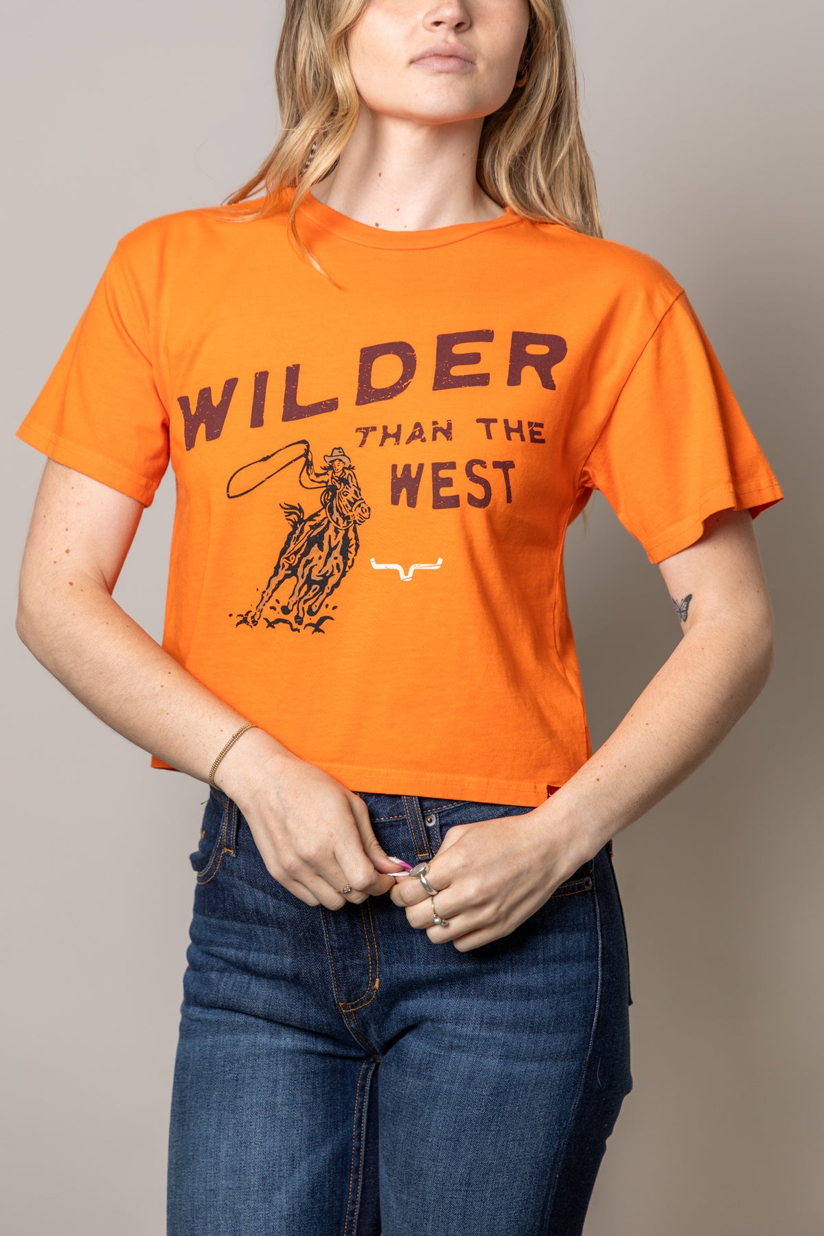 Kimes Ranch Wilder Than The West shirt in Vintage Orange with a cowboy graphic and text