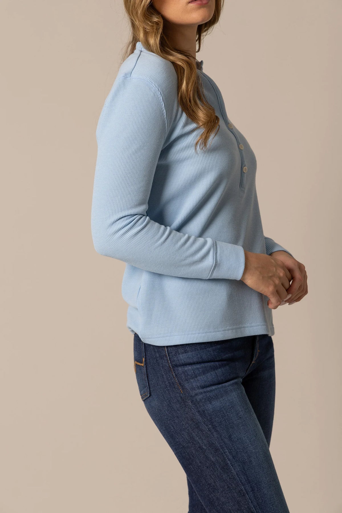 Kimes Ranch Wilma top in Sky Blue, side view, a long sleeve henley with a ribbed texture and button placket