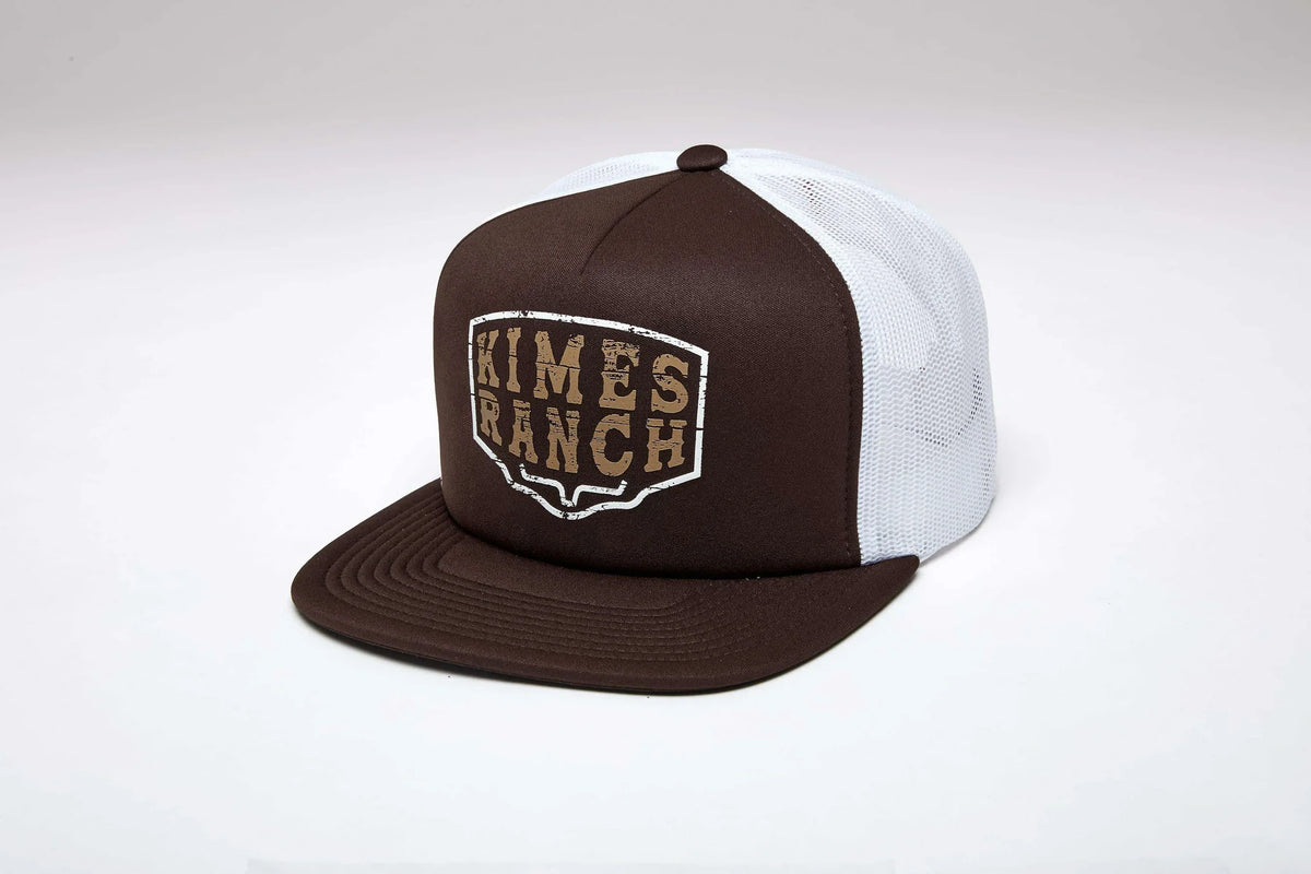 Kimes Ranch Wood Block hat in Brown, side view, with a white mesh back and the Kimes Ranch logo on the front