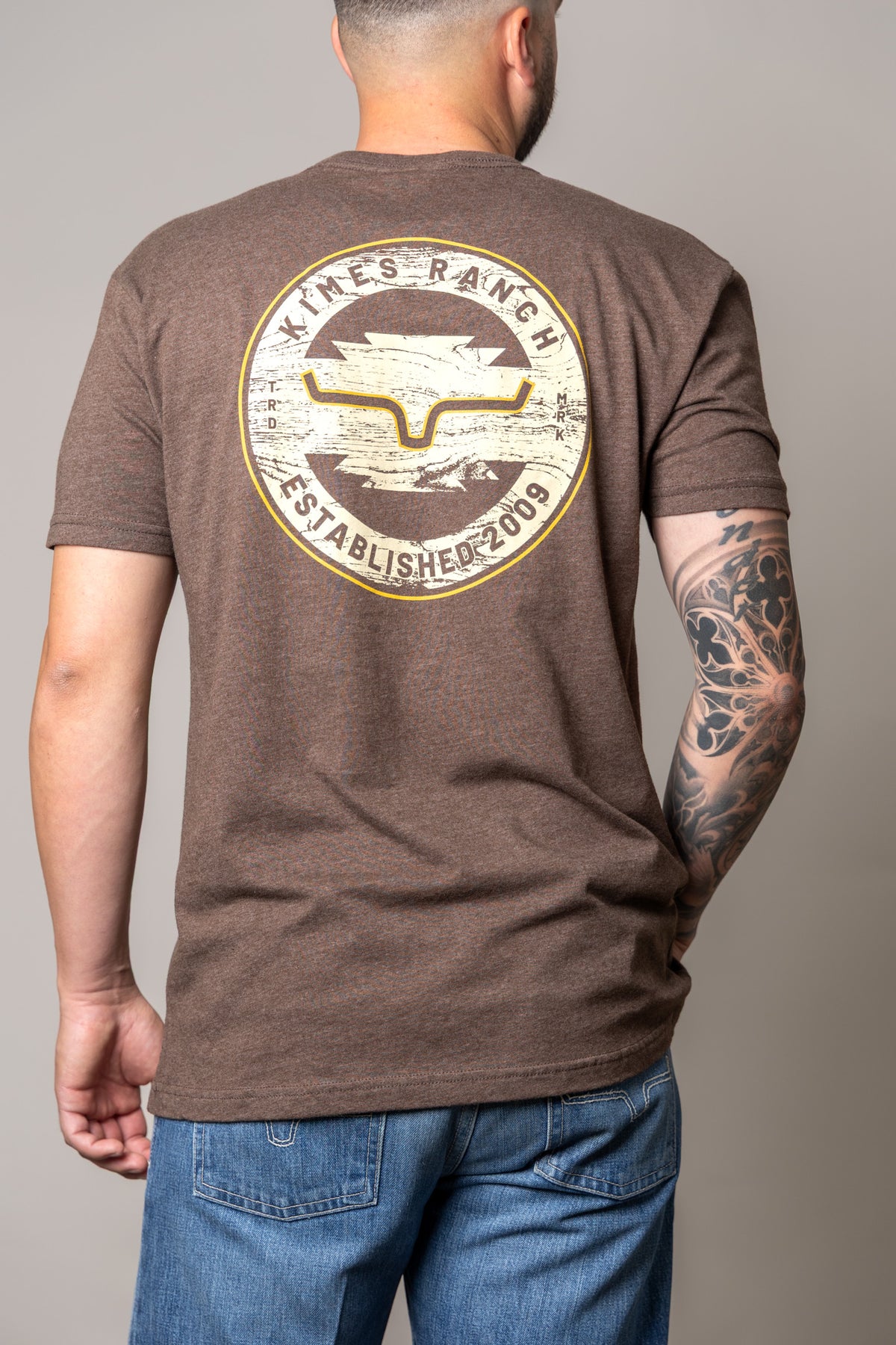 Kimes Ranch Wood Stamp shirt in Espresso, back view, with a large back graphic featuring the Kimes Ranch logo