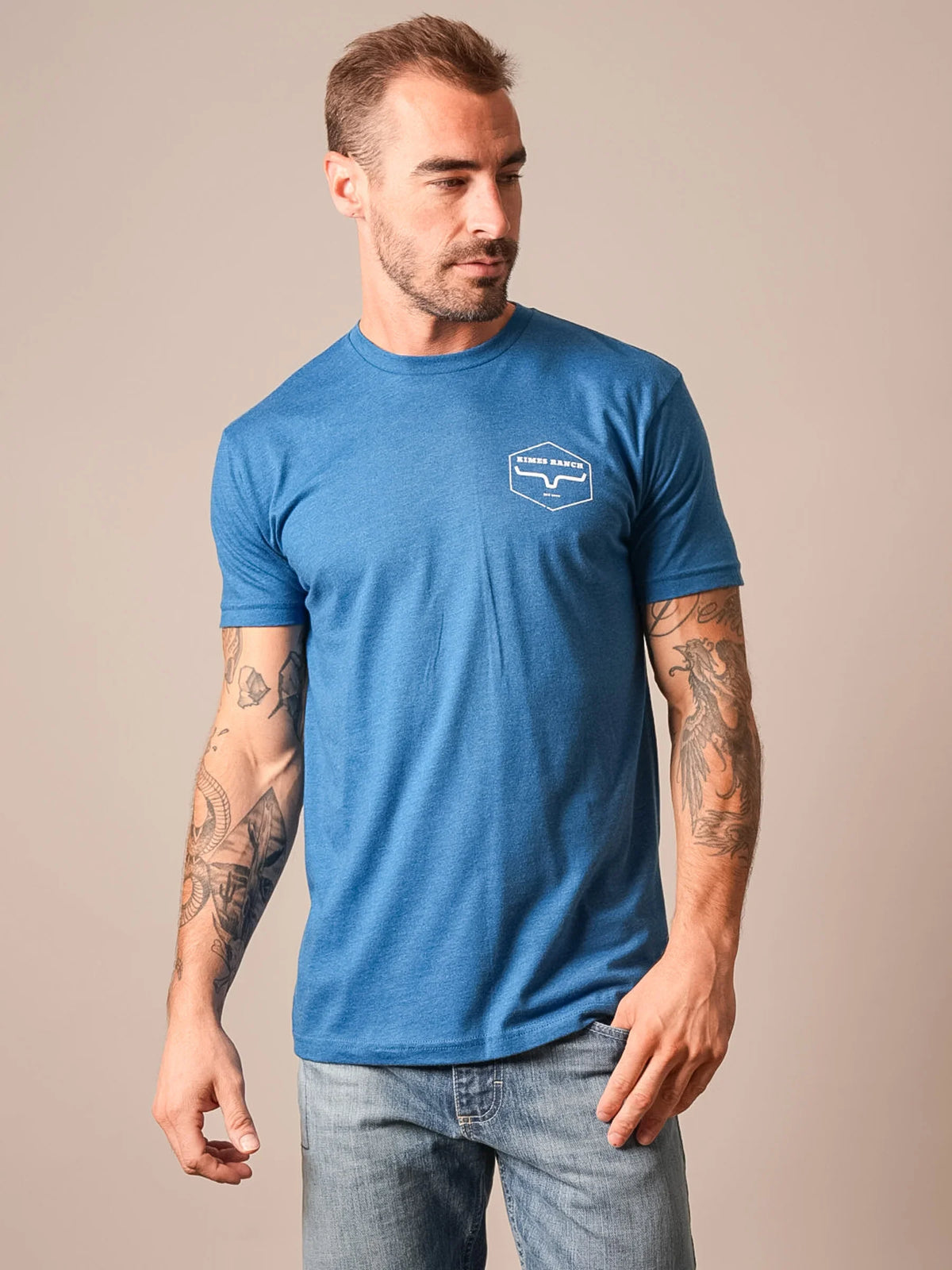 Kimes Ranch Wooden Hex shirt in Heather Cool Blue with short sleeves and a chest logo