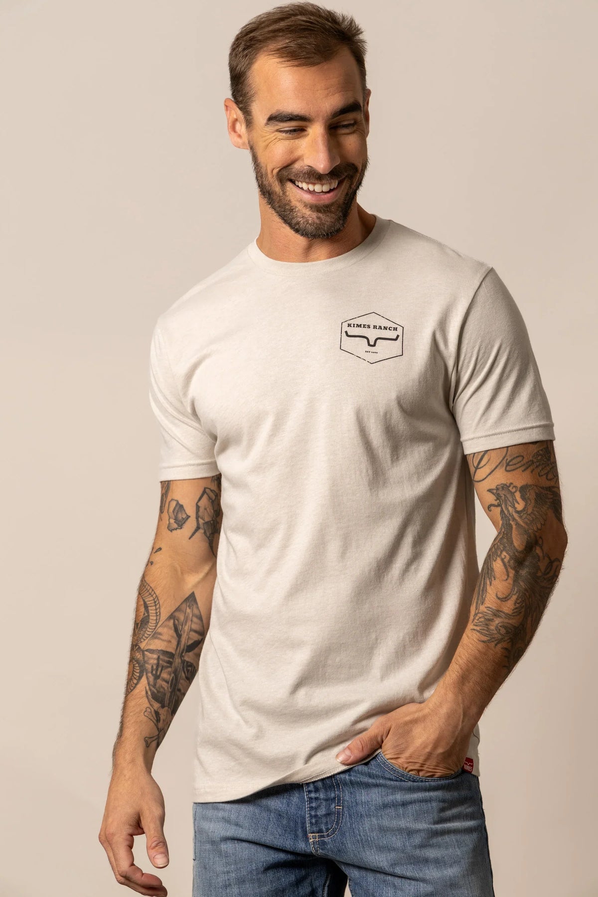 Kimes Ranch Wooden Hex short sleeve shirt in Sand with a small Kimes Ranch logo on the chest