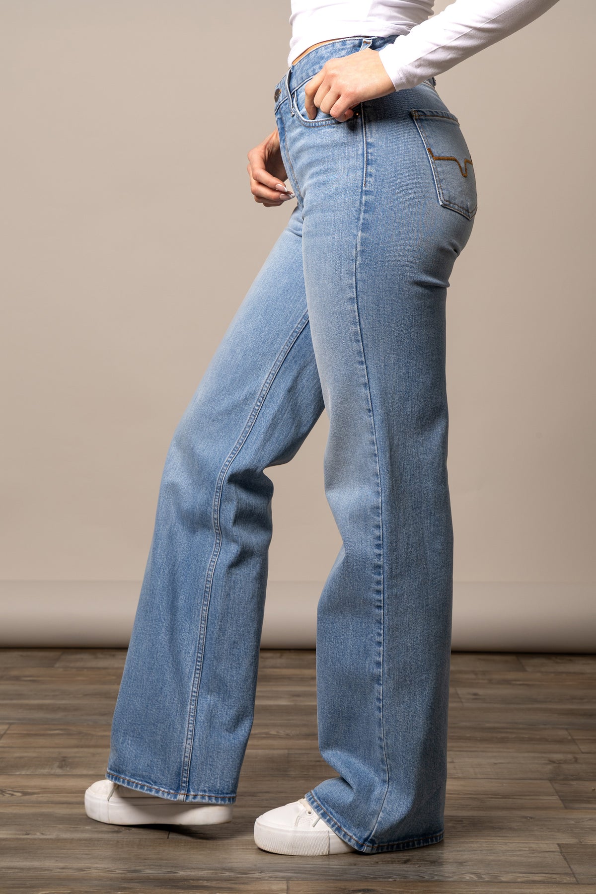 Kimes Ranch Zoey jeans in Light Wash, side view, with a wide leg silhouette and back pocket stitching