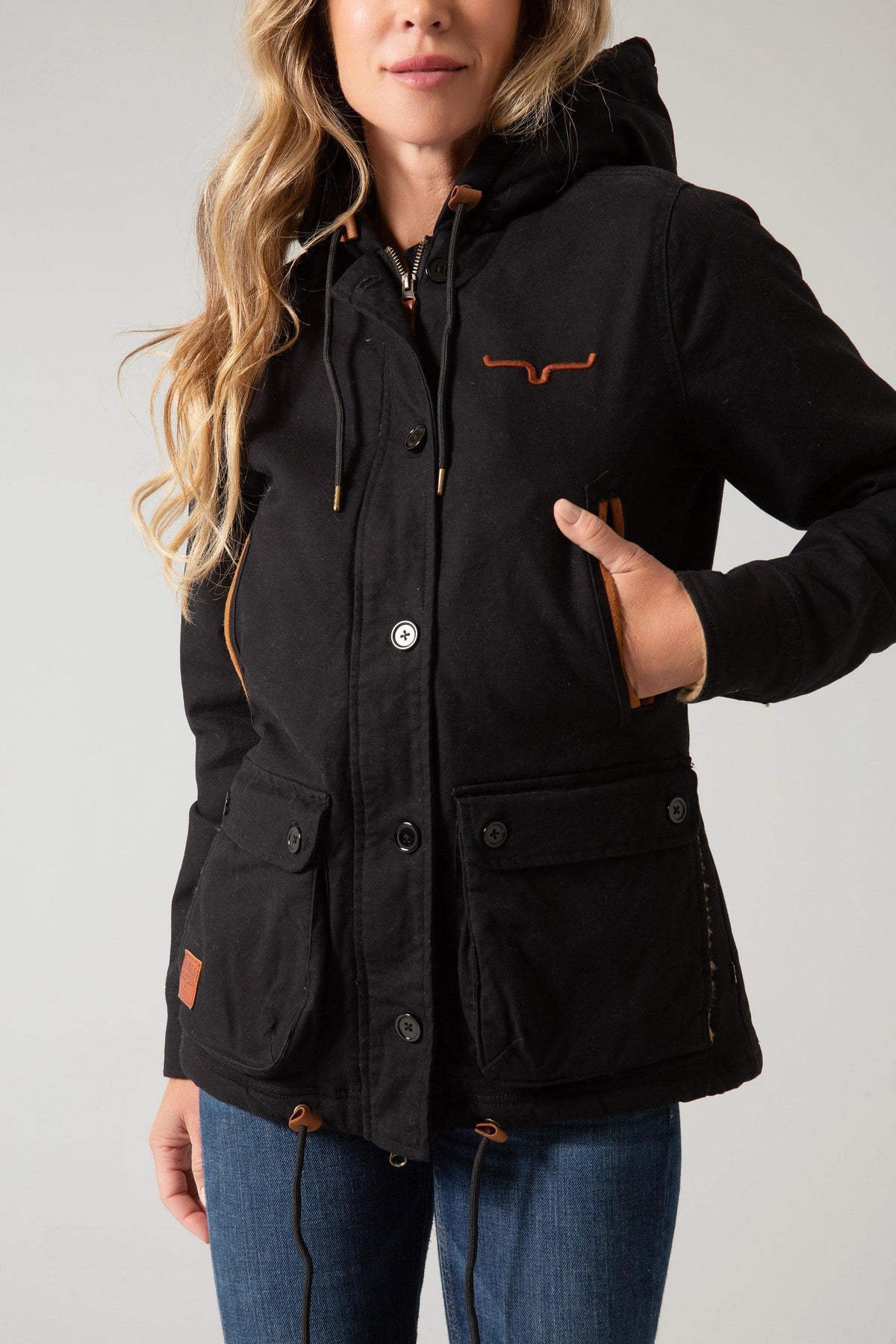 Kimes Ranch AWA Jacket in Black with the Kimes Ranch logo, front pockets, and drawstring hood