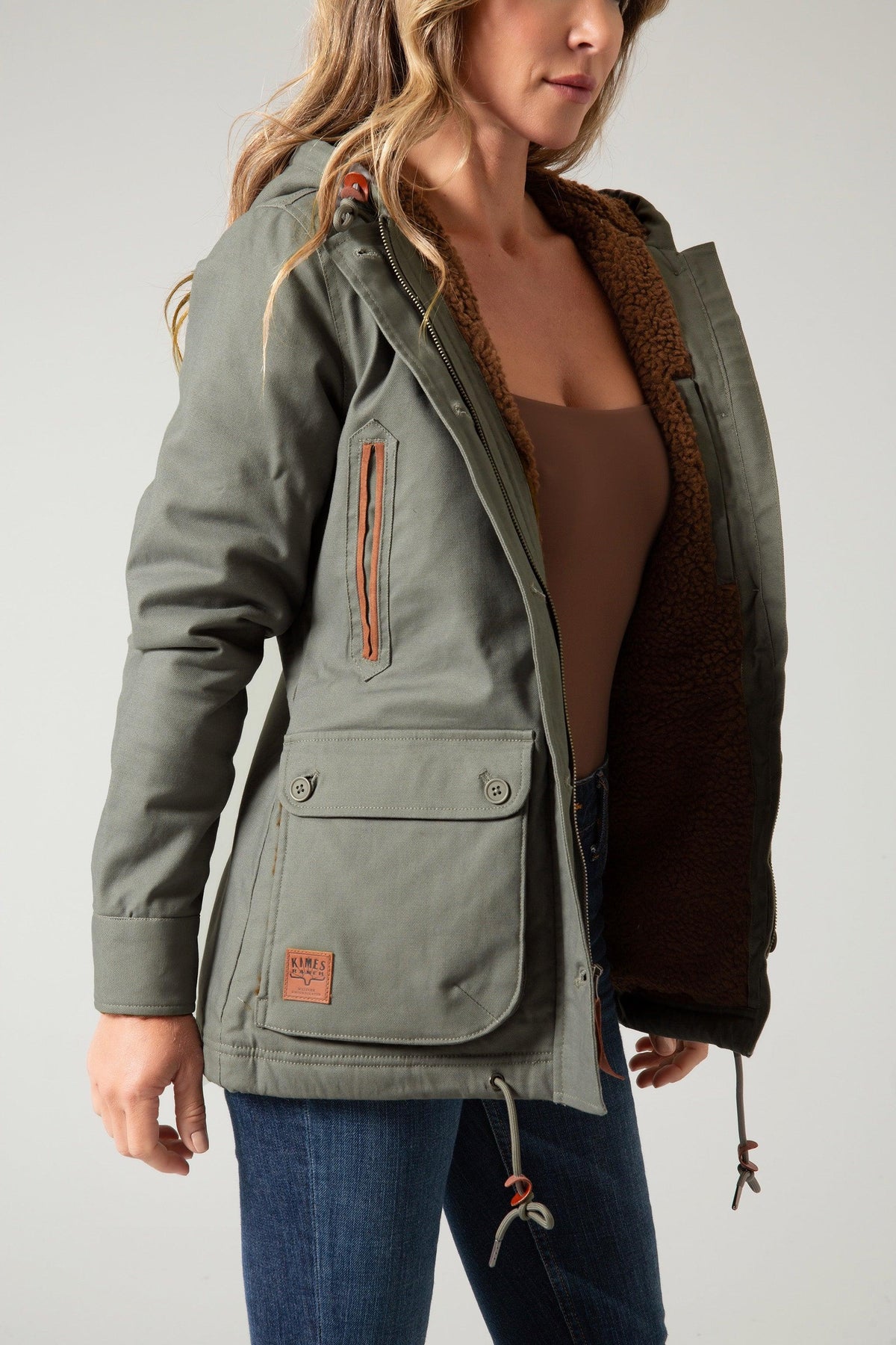 Kimes Ranch AWA Jacket in Dark Army, side view, with sherpa lining and front flap pocket