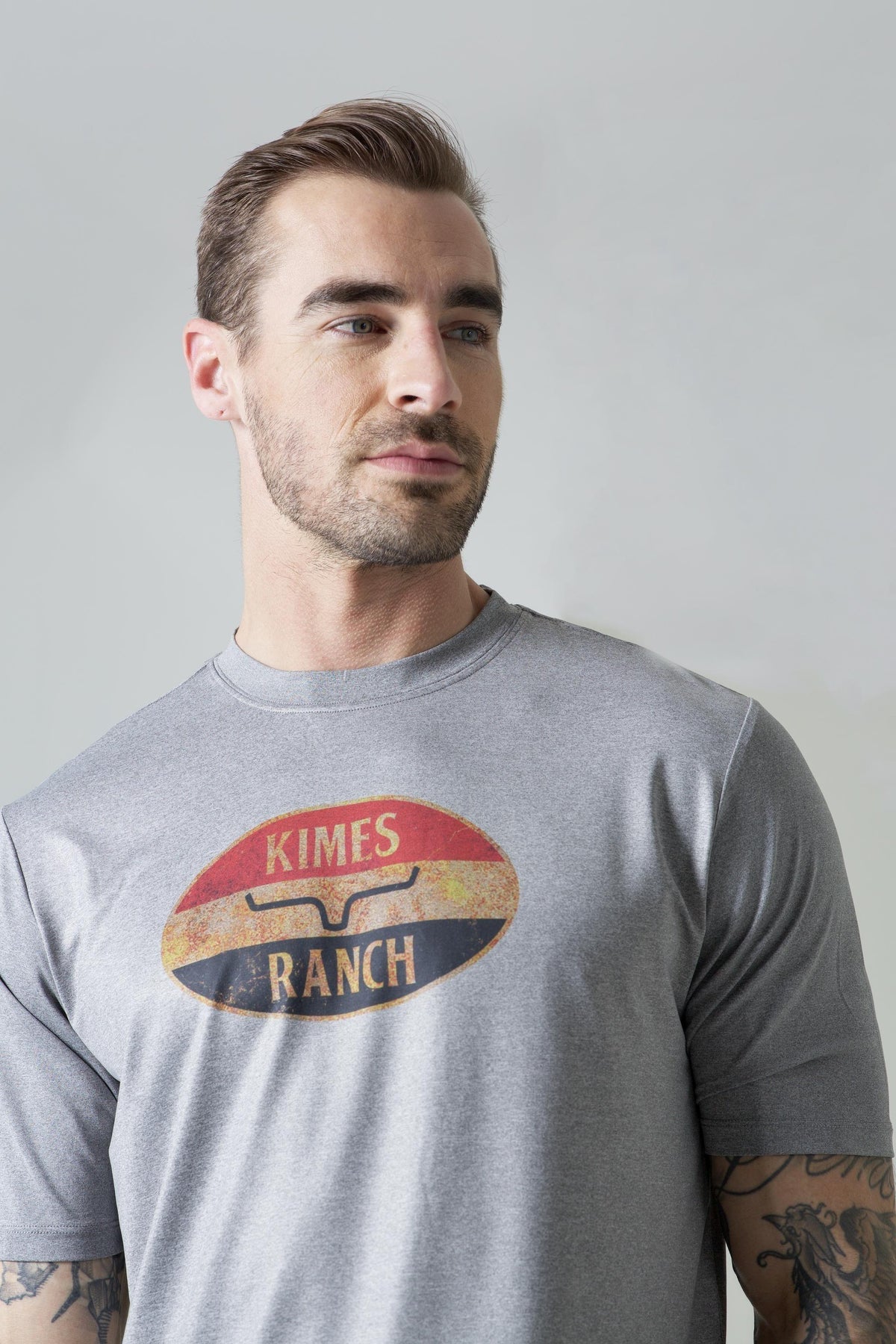 Kimes Ranch American Standard Tech T-Shirt in Athletic Grey Heather with a vintage oval Kimes Ranch logo