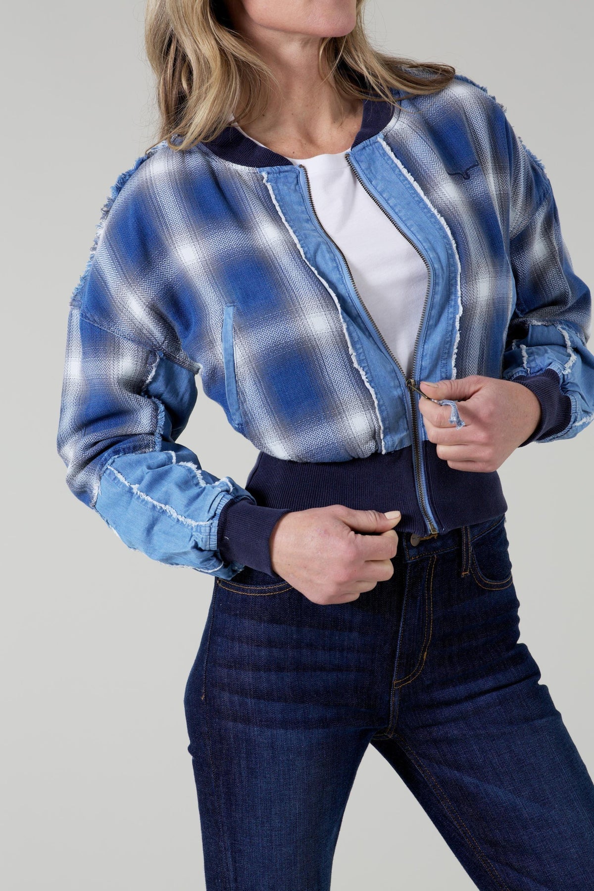 Kimes Ranch Belinda Bomber Jacket in blue plaid with distressed trim and ribbed navy cuffs