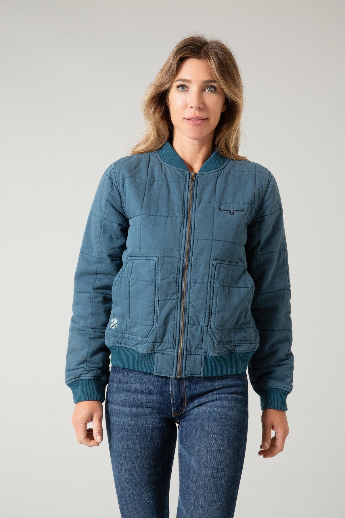 Kimes Ranch Bronc Bomber Jacket in blue with a quilted pattern, ribbed collar and cuffs, and front pockets
