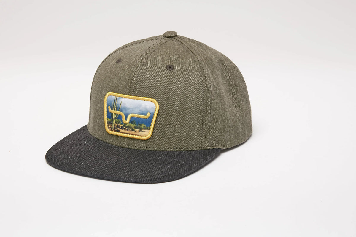 Kimes Ranch Buckley Hat in Army, side view, with a front patch showing a cactus and longhorn logo