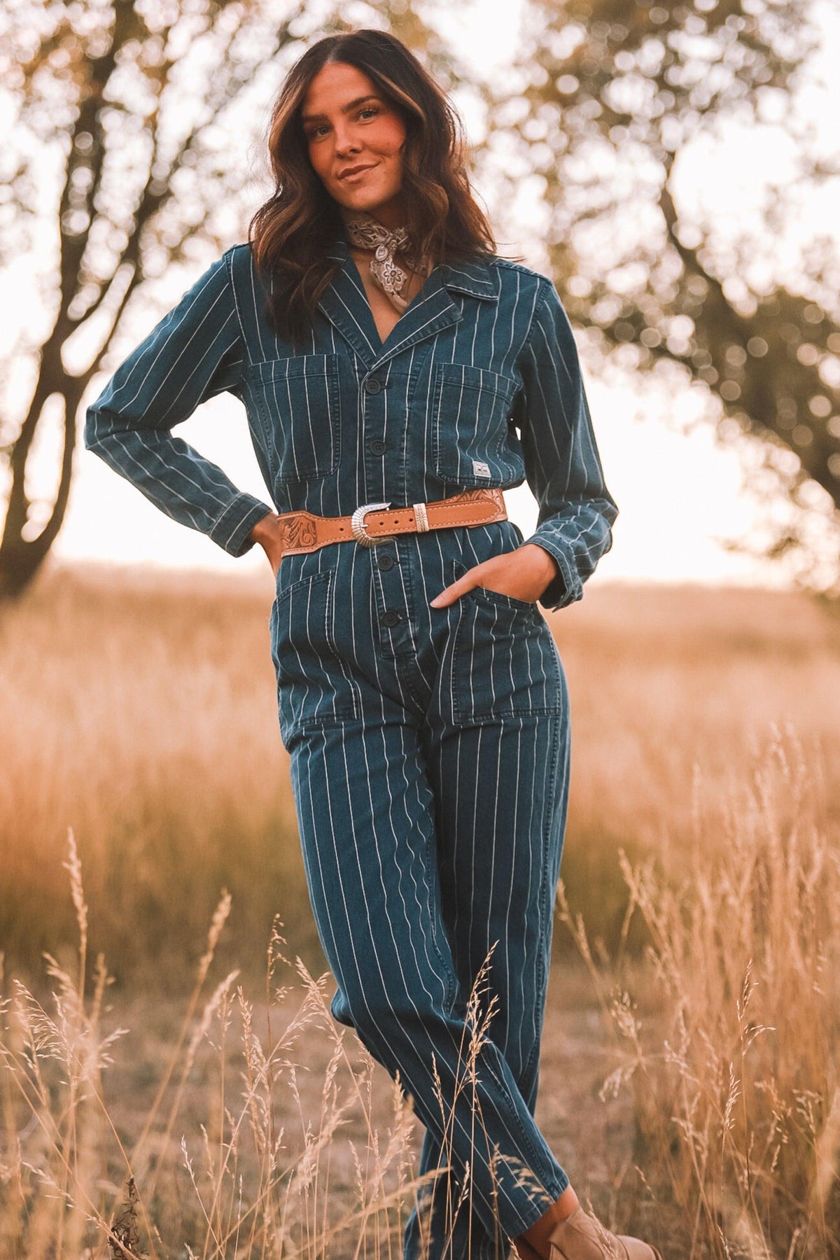Kimes Ranch Chimayo Jumpsuit in Indigo with long sleeves, front pockets, and a button-down front
