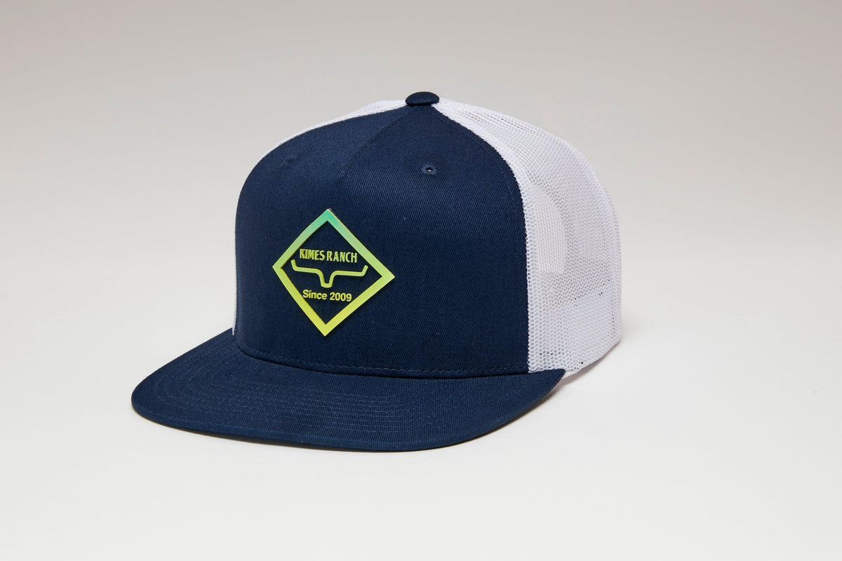 Kimes Ranch Diamond Dogs Trucker Hat in Navy, side view, with white mesh back and Kimes Ranch logo