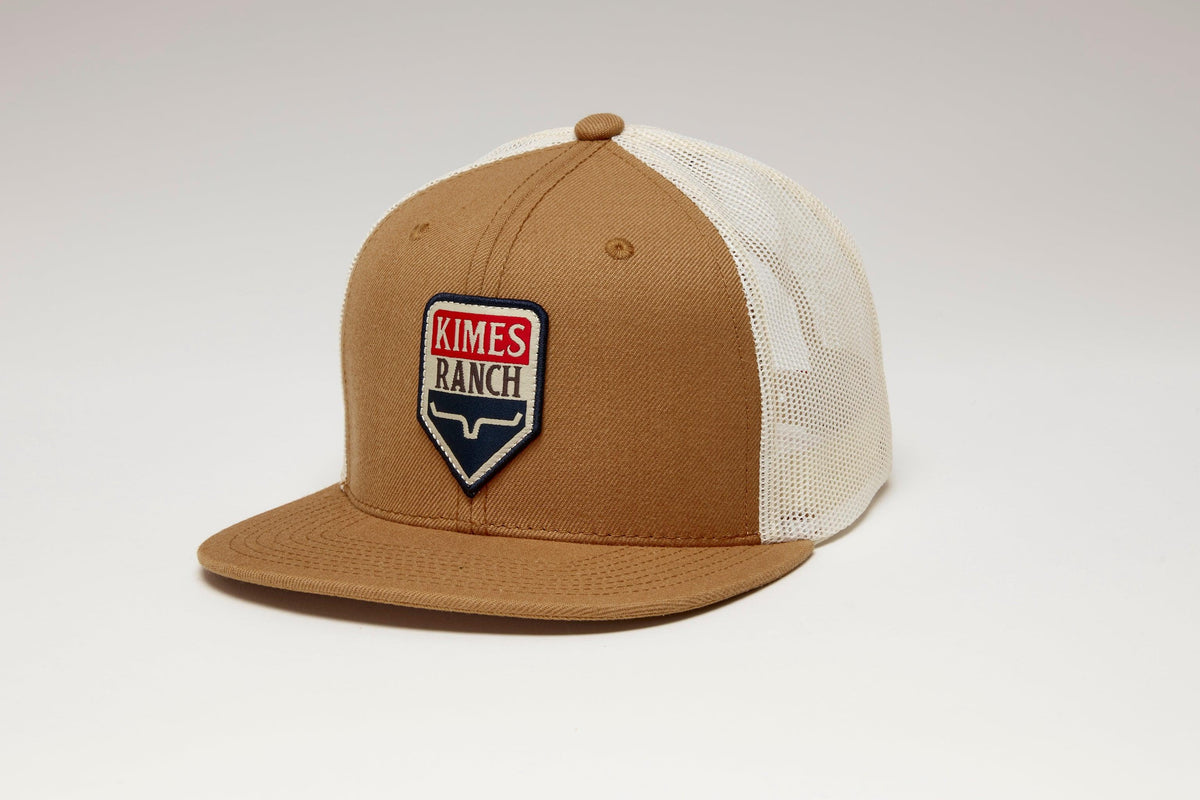 Kimes Ranch Drop In Americana Hat in Work Wear Brown, side view, with a shield logo and white mesh back
