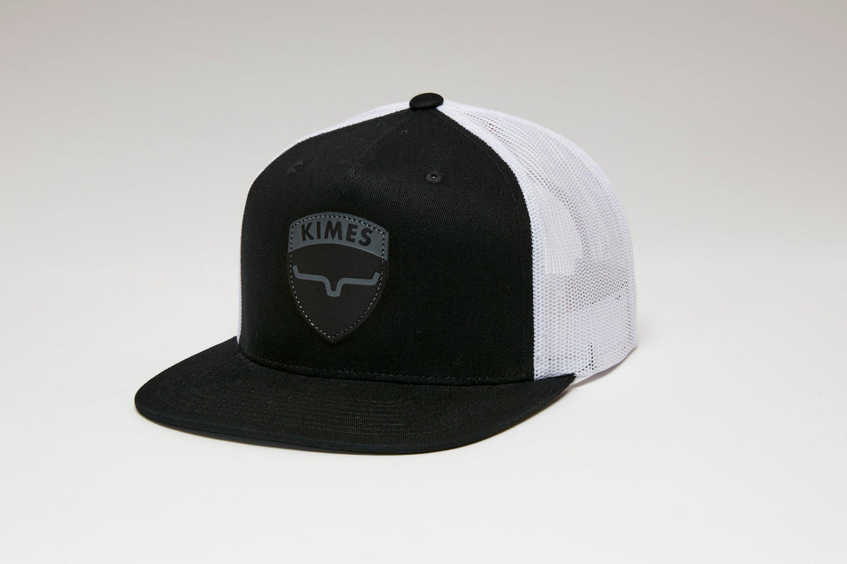 Kimes Ranch Falcon Trucker Hat in Black, side view, with a white mesh back and the Kimes Ranch logo on the front