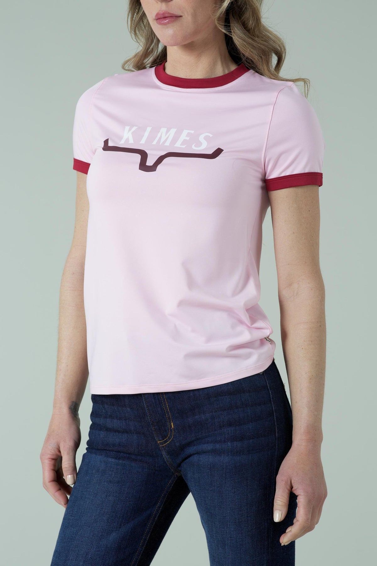 Kimes Ranch Fast Kimes Tech Tee in Blush with maroon ringer trim and the Kimes Ranch logo on the chest