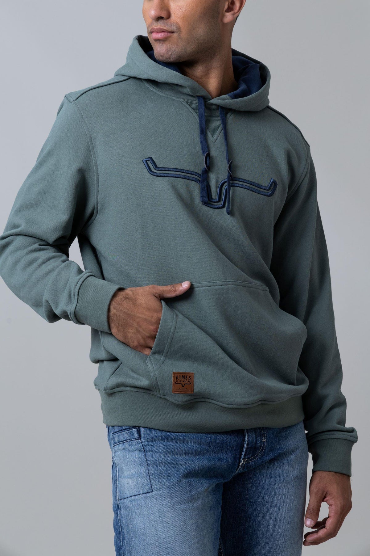 Kimes Ranch Fast Talker Hoodie in Pine with contrast stitching and front pocket