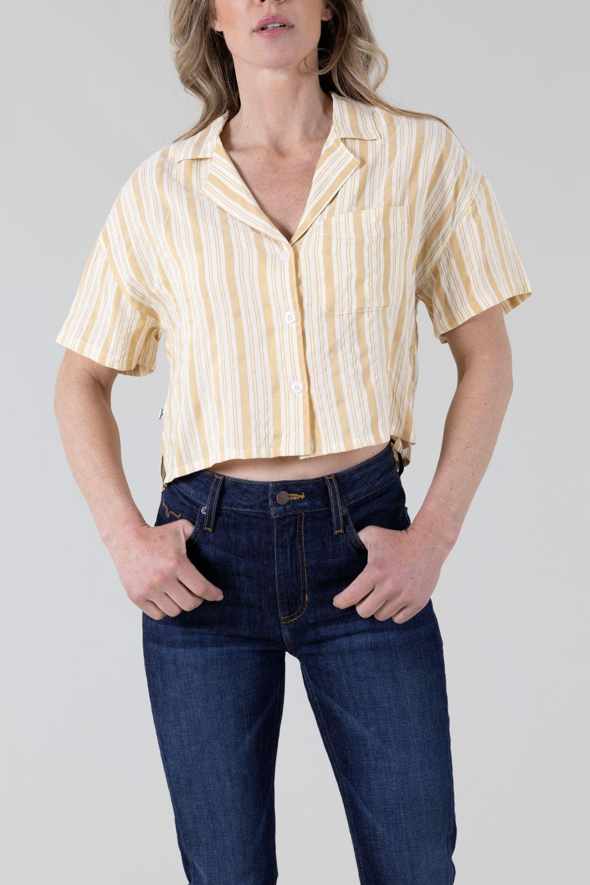 Kimes Ranch Ferris Top in Yellow Ocre with a striped pattern, short sleeves, and a front pocket