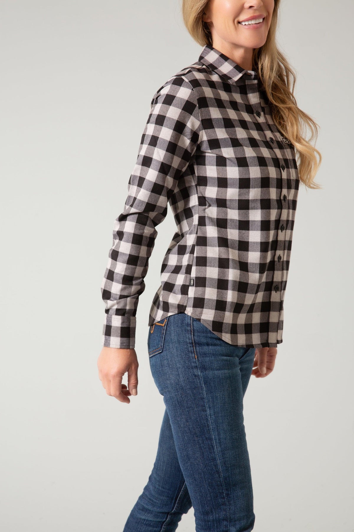 Kimes Ranch Ladies Garrison, side view, long sleeve button-up shirt in black and white buffalo plaid with a collar