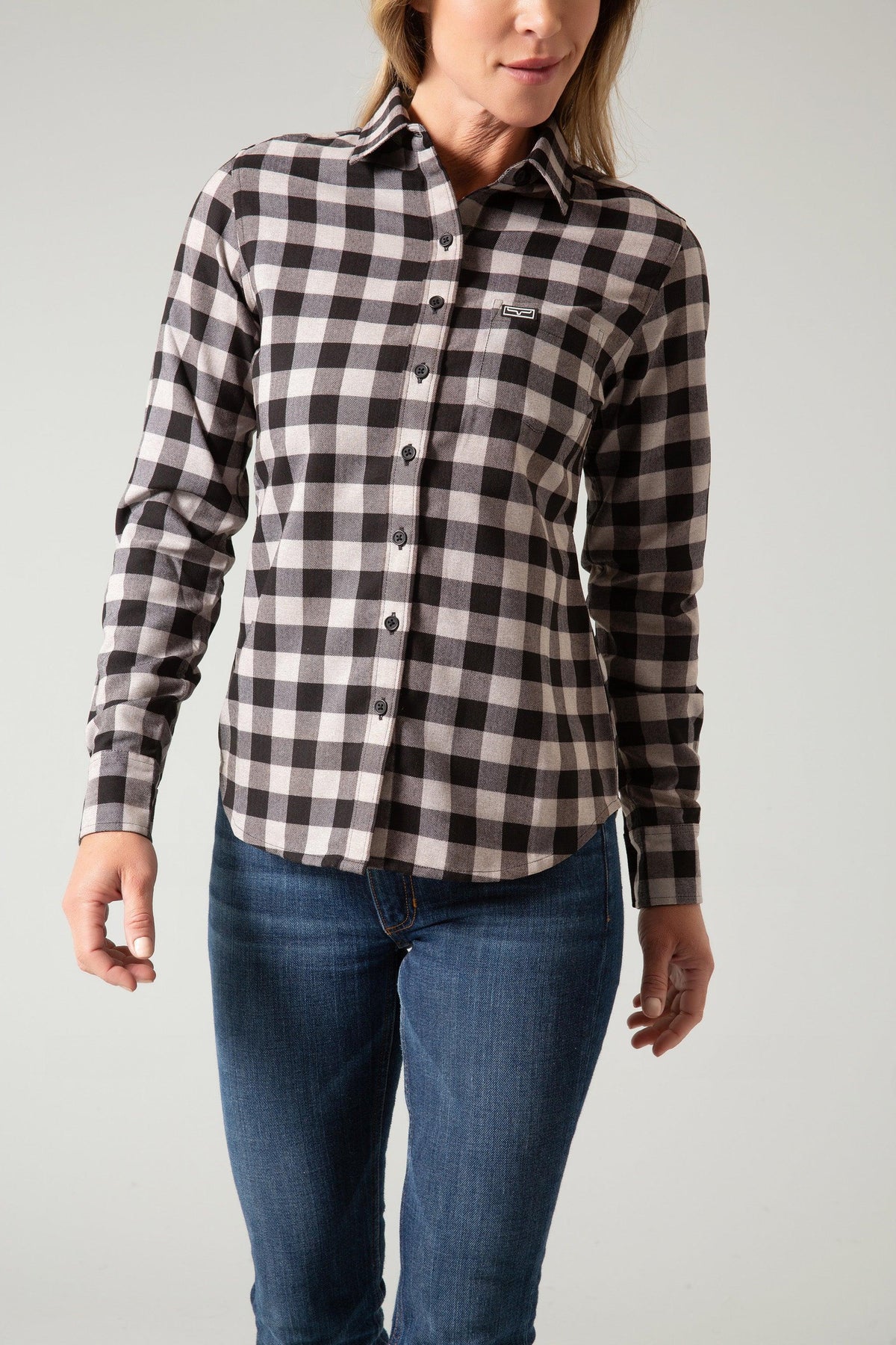 Kimes Ranch Ladies Garrison long sleeve button-up top in black and white buffalo plaid with a chest pocket and logo