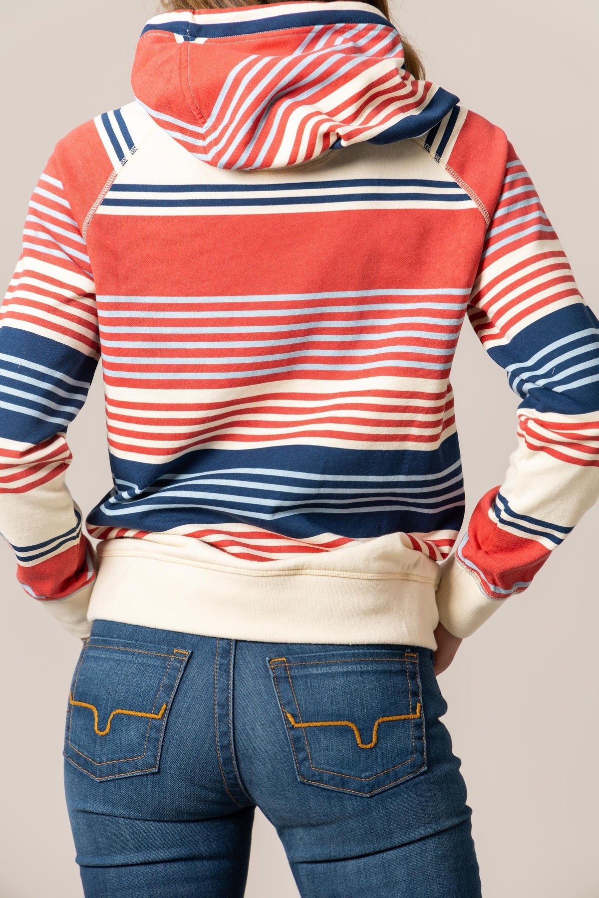 Kimes Ranch Golinda Pullover Hoodie in Navy, back view, with red and white horizontal stripes and a cream hem