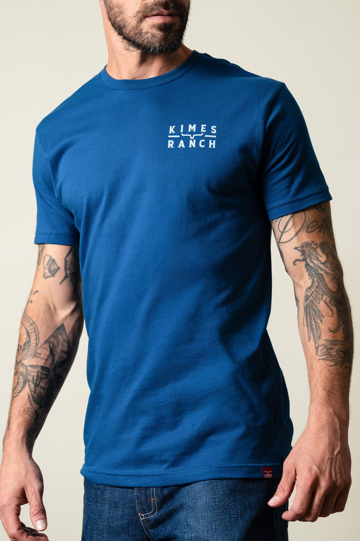 Kimes Ranch Back Branded shirt in Cool Blue, featuring the Kimes Ranch logo and white text on the chest