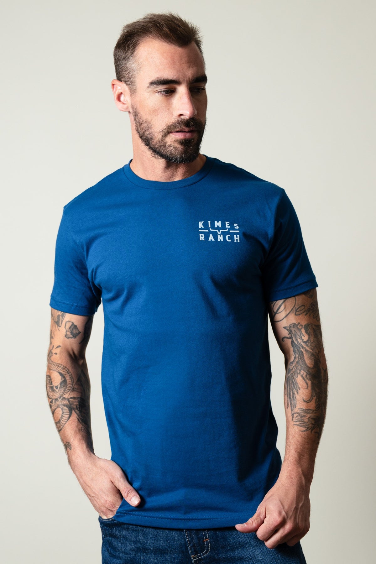 Kimes Ranch Back Branded shirt in Cool Blue with short sleeves, crew neck, and Kimes Ranch logo on chest