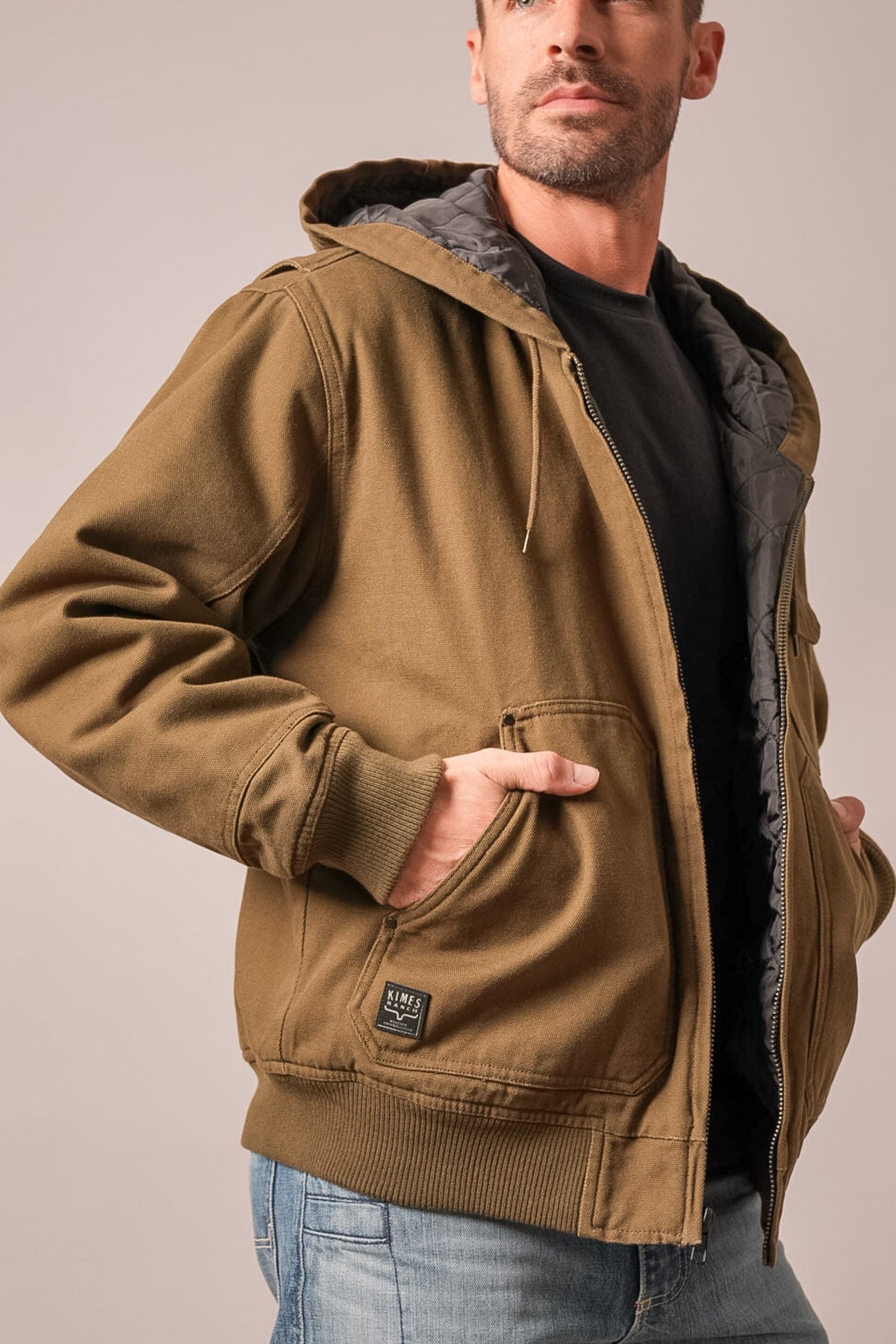 Kimes Ranch Bennett jacket in Army Green with a hood, long sleeves, kangaroo pockets, and a ribbed hem and cuffs