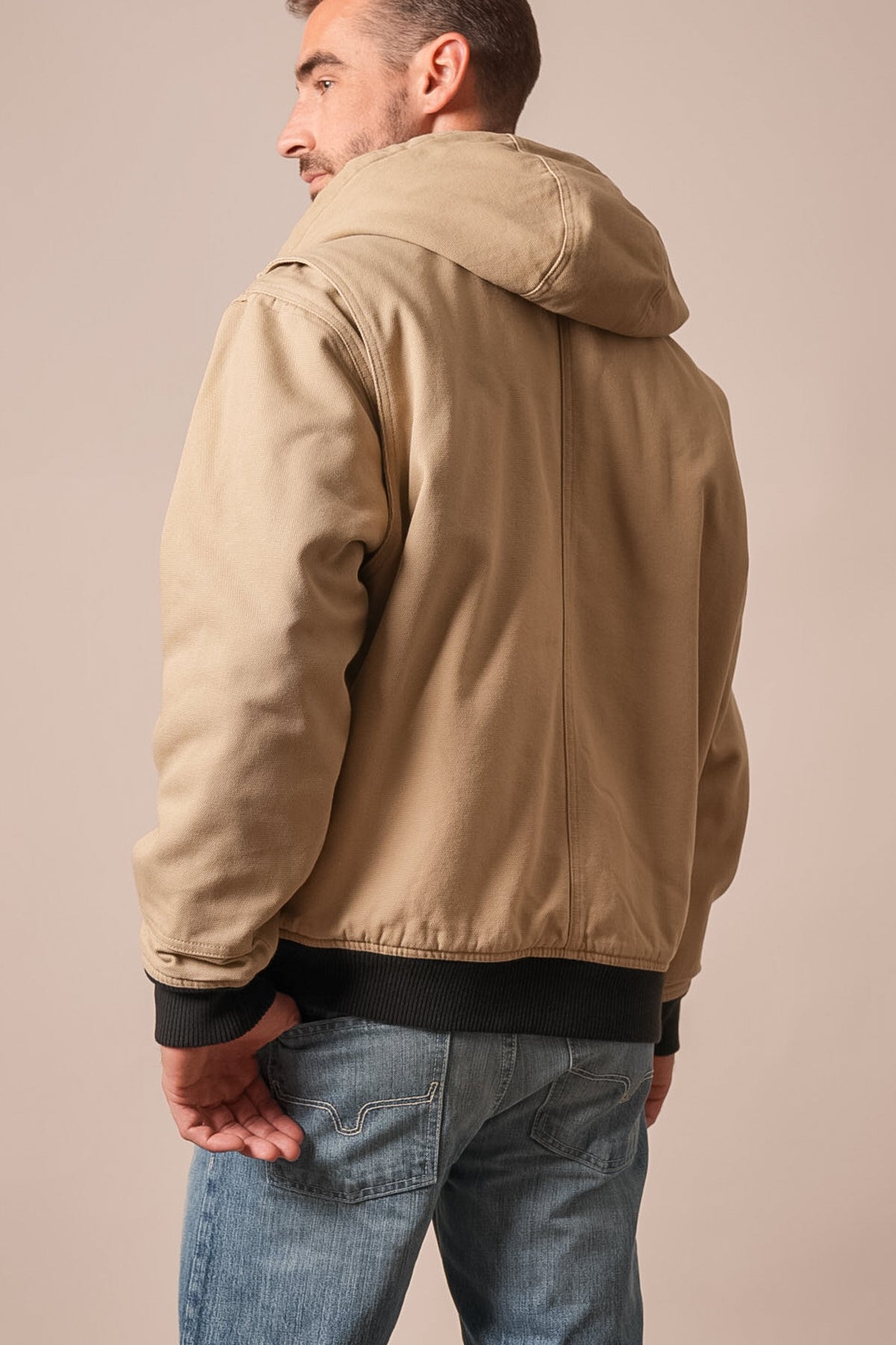 Kimes Ranch Bennett Jacket in taupe, showing back view with hood and contrasting black ribbed cuffs and hem