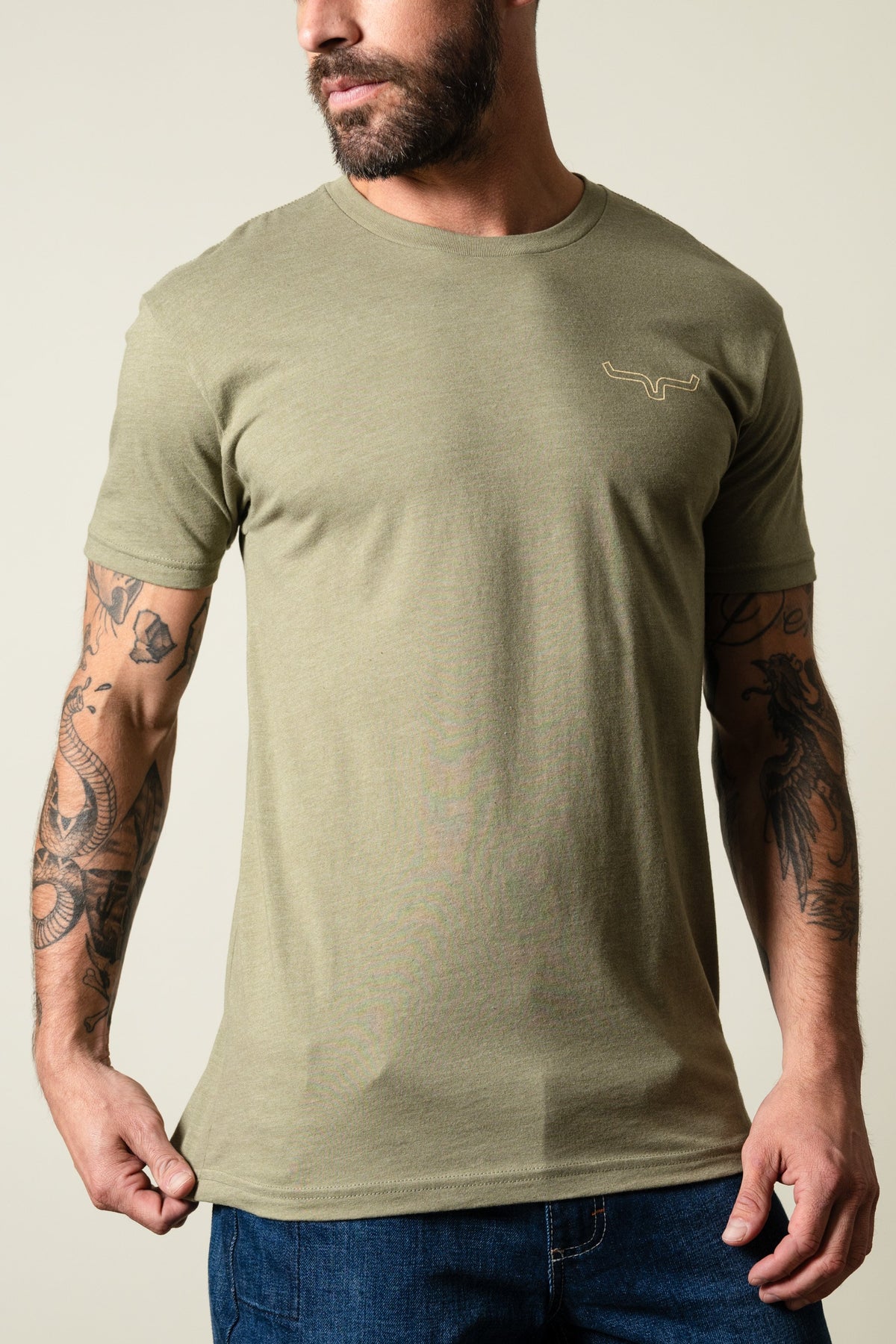 Kimes Ranch Camo Back t-shirt in light olive with short sleeves and a crewneck, featuring the Kimes Ranch logo on the chest