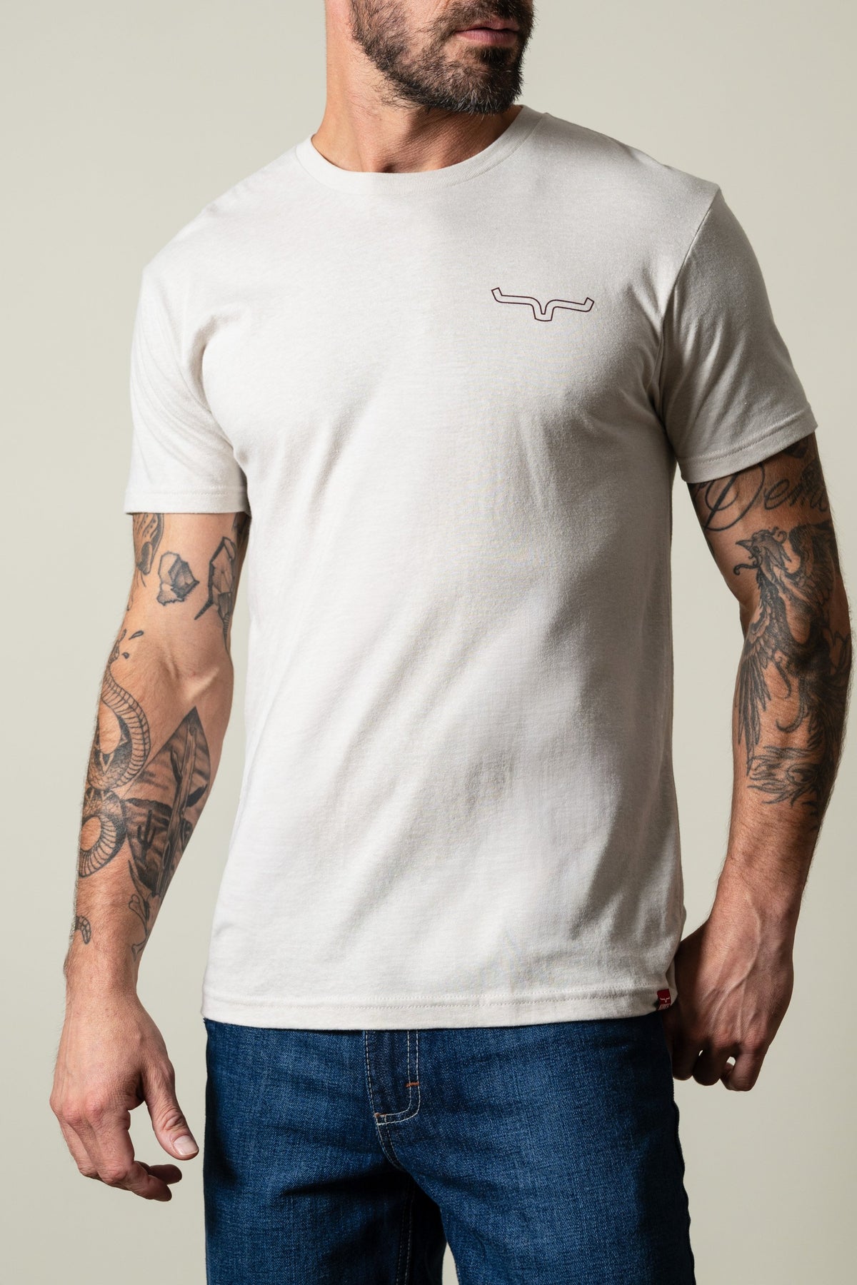 Kimes Ranch Camo Back shirt in Sand with short sleeves, crew neck, and Kimes Ranch logo on left chest