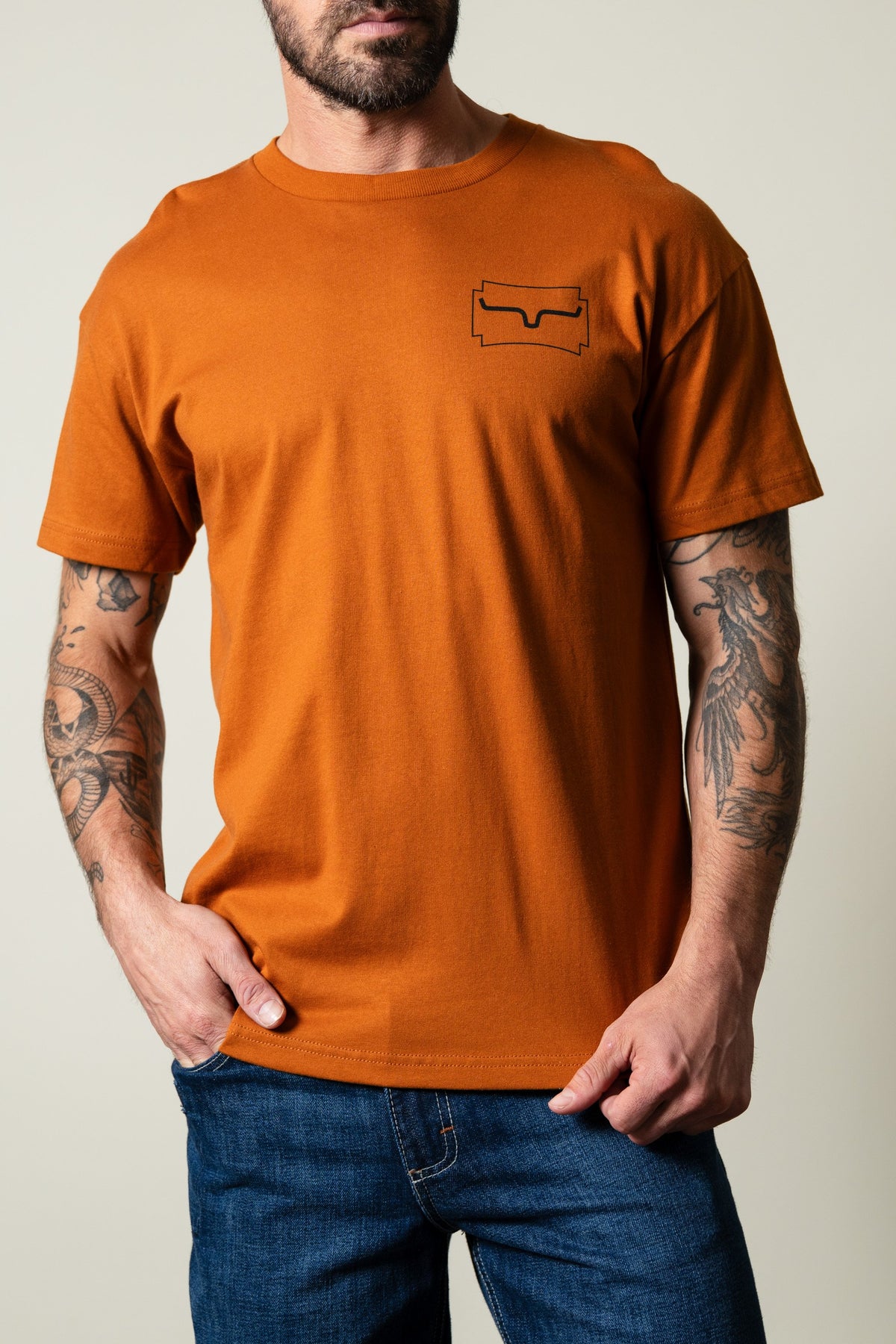 Kimes Ranch Camo Crest short sleeve t-shirt in clay, front view with chest logo