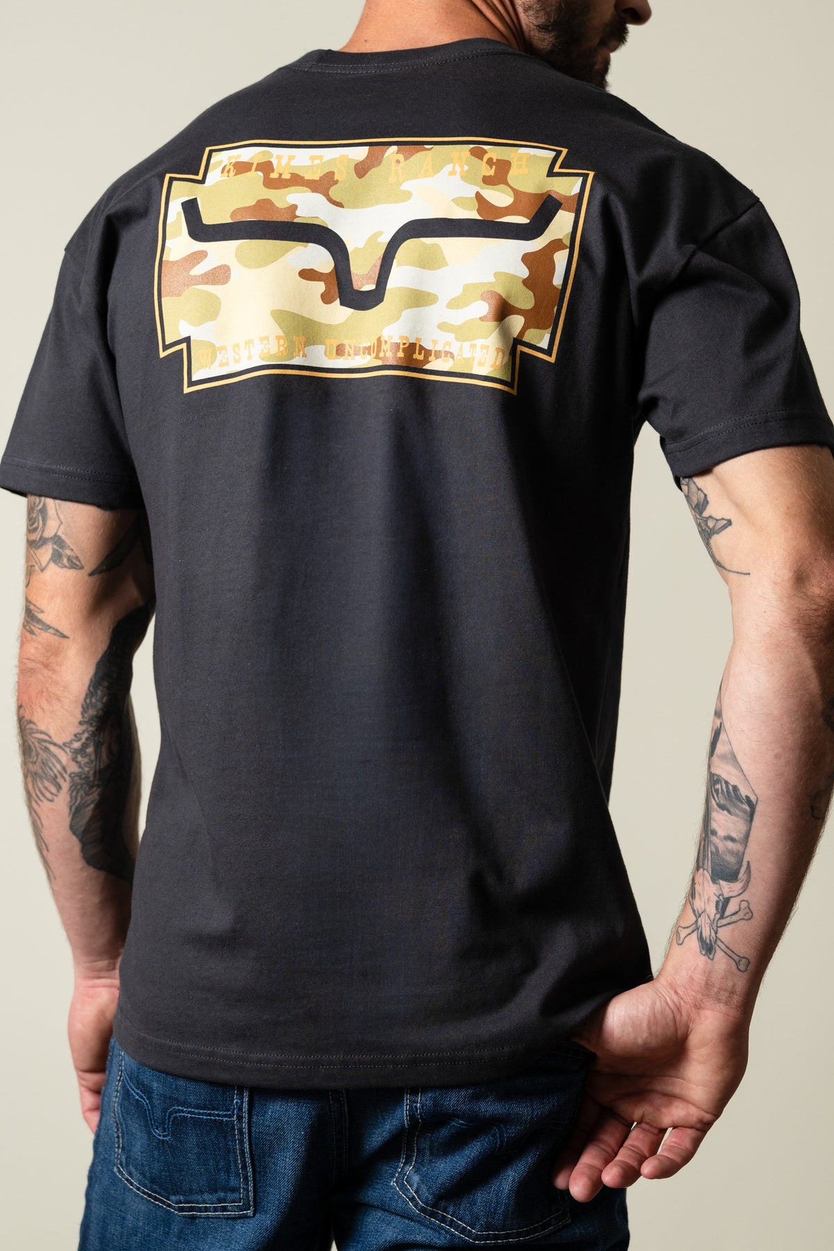 Kimes Ranch Camo Crest graphite black short-sleeve tee with camo crest graphic on back