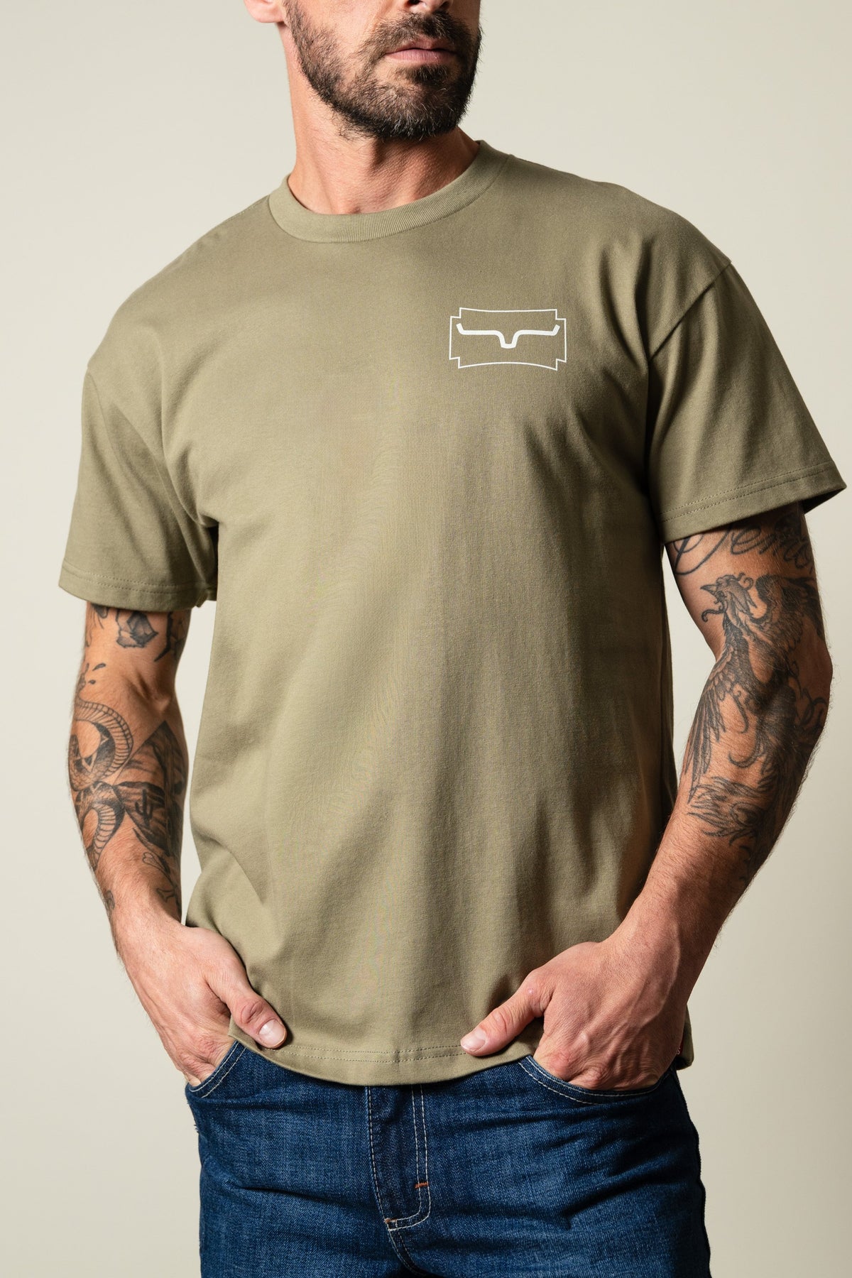 Kimes Ranch Camo Crest shirt in Light Olive, short sleeve crew neck tee with a white Kimes Ranch logo on the left chest