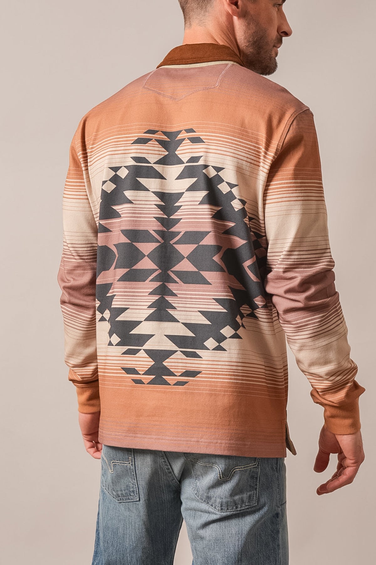 Kimes Ranch Clifton Brown long sleeve polo shirt back view featuring a large geometric pattern and horizontal stripes