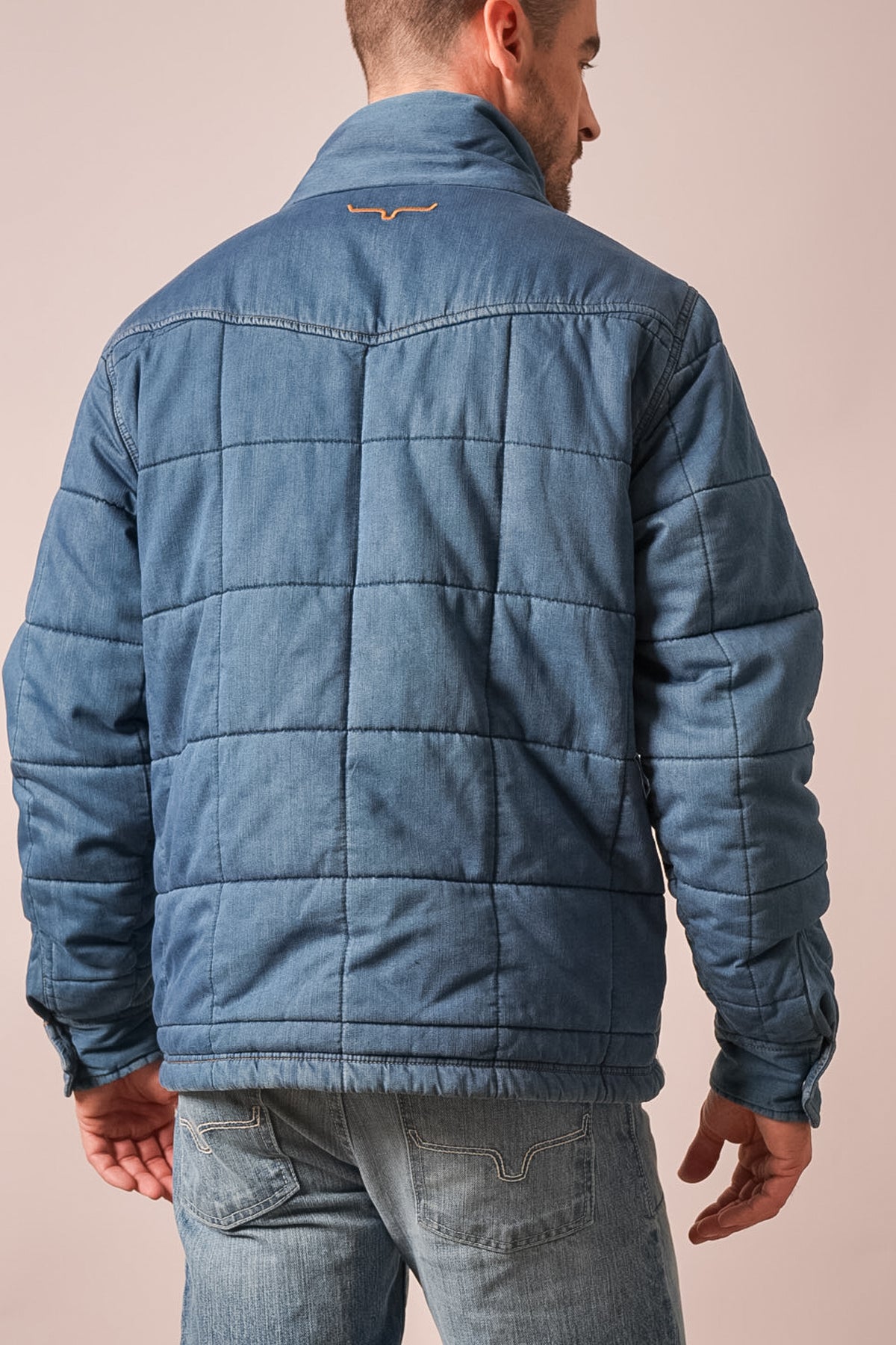 Kimes Ranch Colt jacket in indigo, shown from back with grid quilting, long sleeves, and Kimes Ranch logo at collar