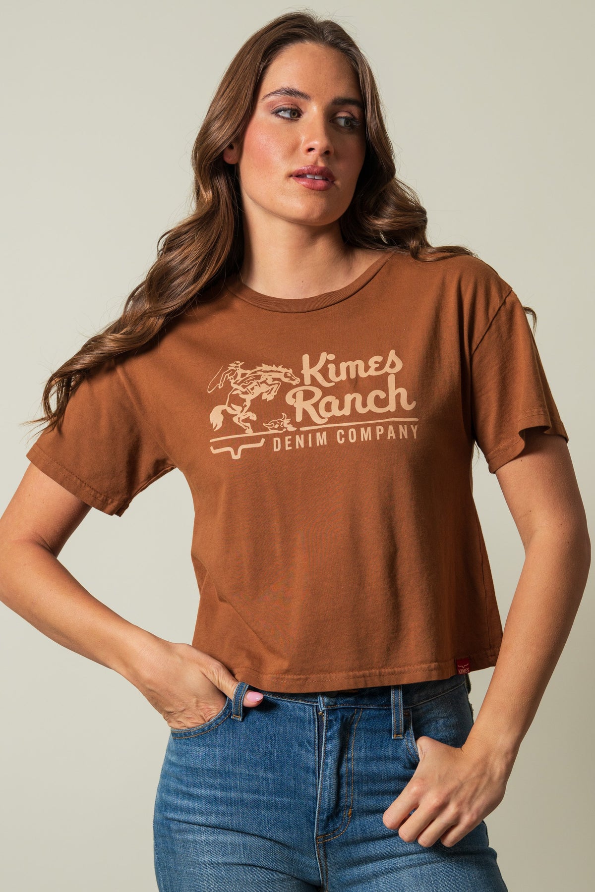 Kimes Ranch Davona Dale brown short sleeve crewneck tee with graphic print, "Kimes Ranch" and "DENIM COMPANY" in cream