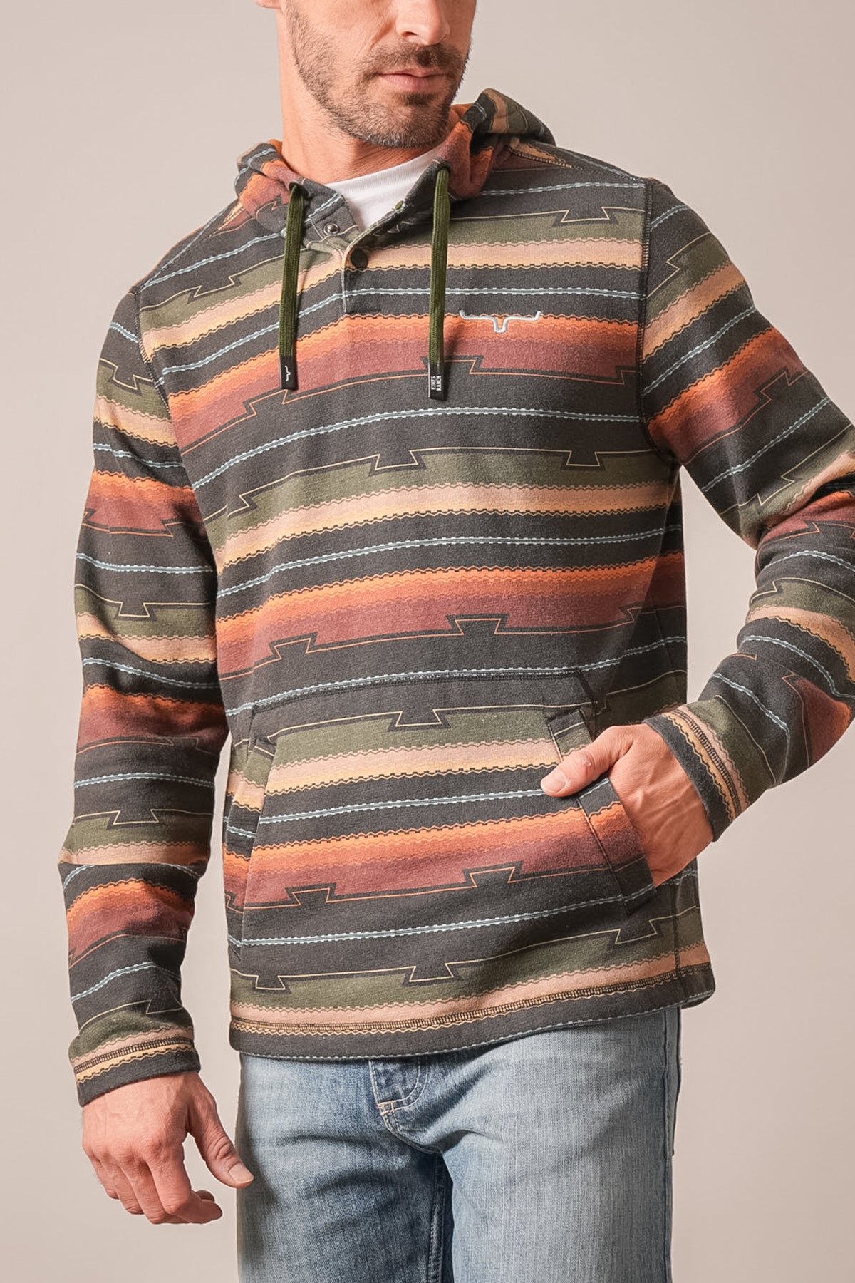 Kimes Ranch Dogwood hoodie in black with orange, green, and brown geometric stripes, kangaroo pocket, and Kimes Ranch logo