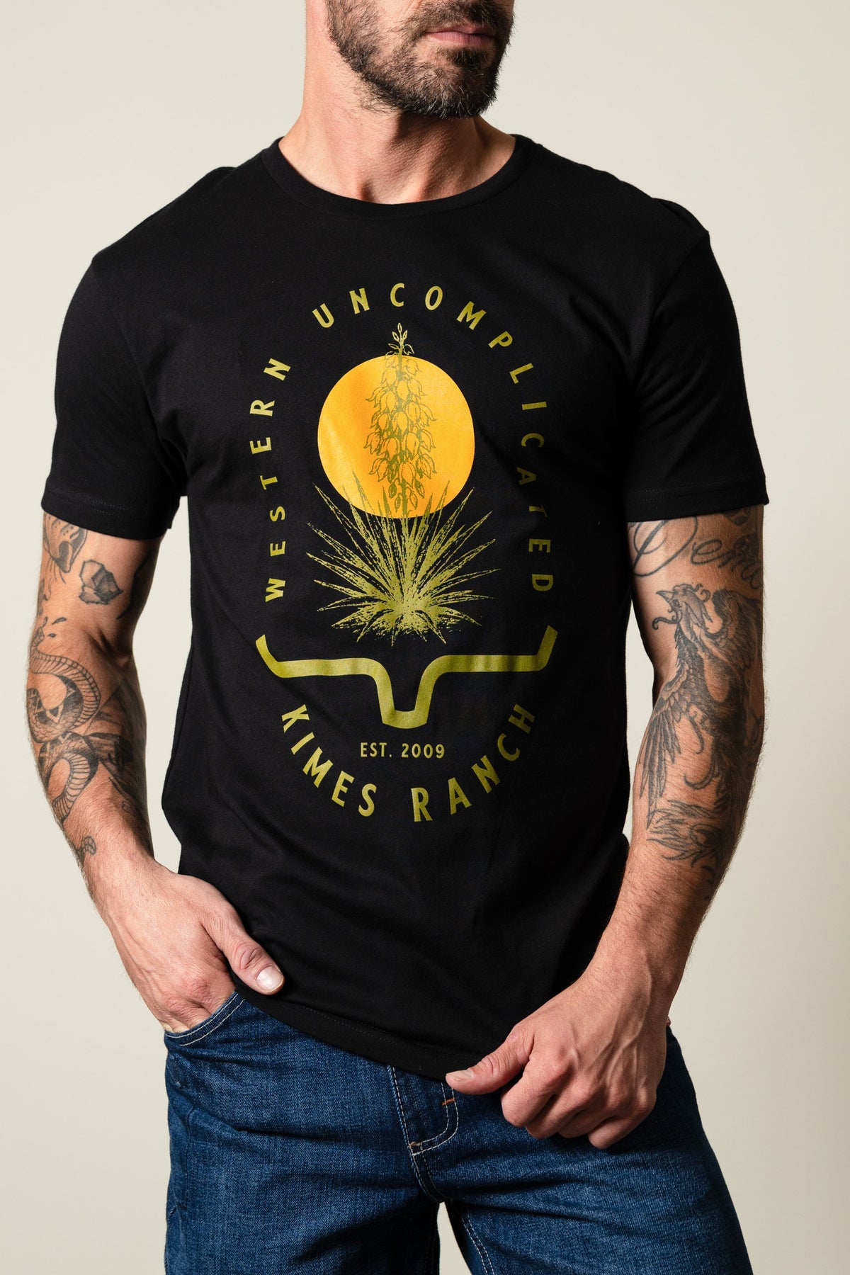 Kimes Ranch Drought Resistant black shirt with graphic of yucca and text reading 'WESTERN UNCOMPLICATED KIMES RANCH