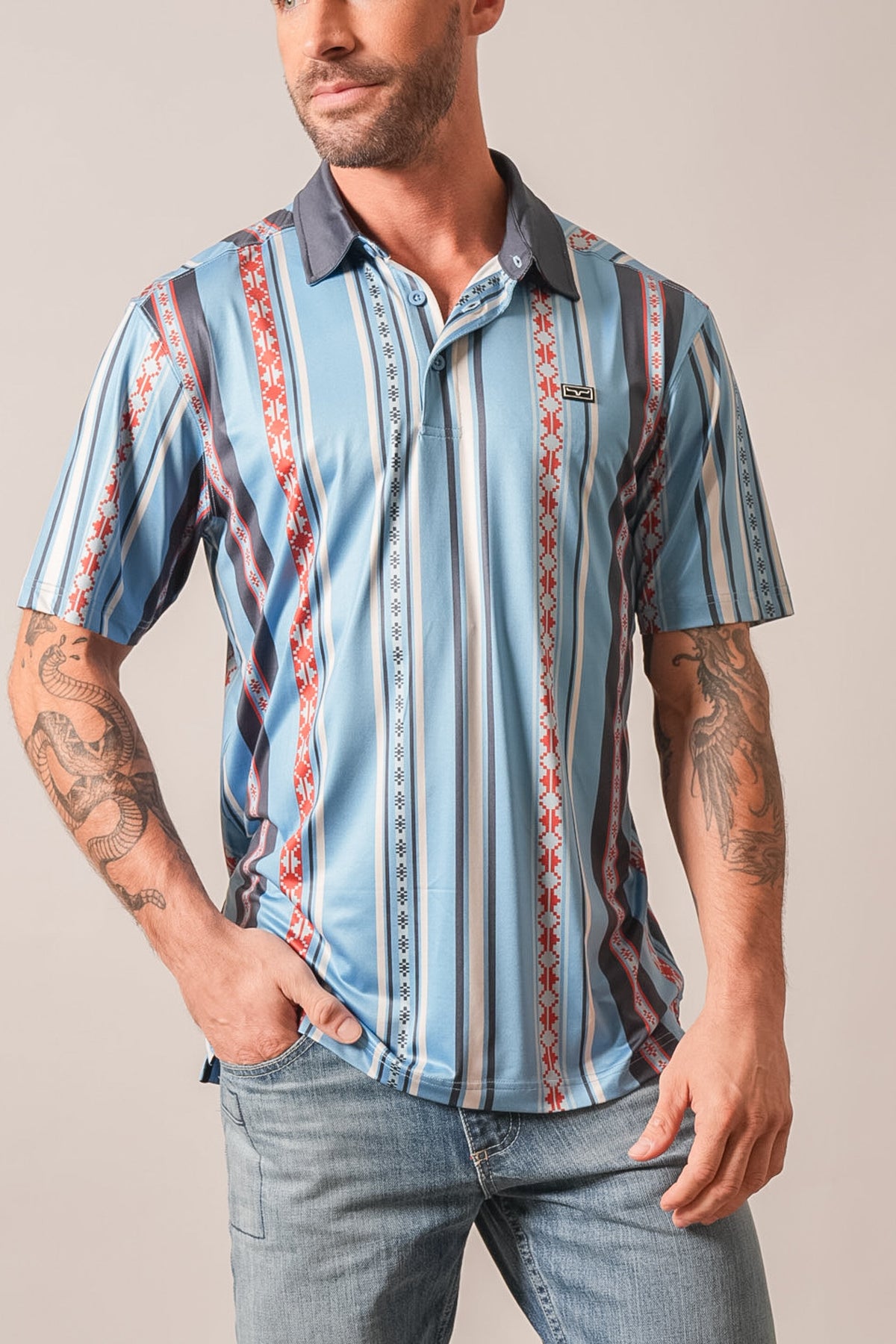 Kimes Ranch Evans polo shirt in Mid Blue with multi-color tribal striped pattern and Kimes Ranch logo