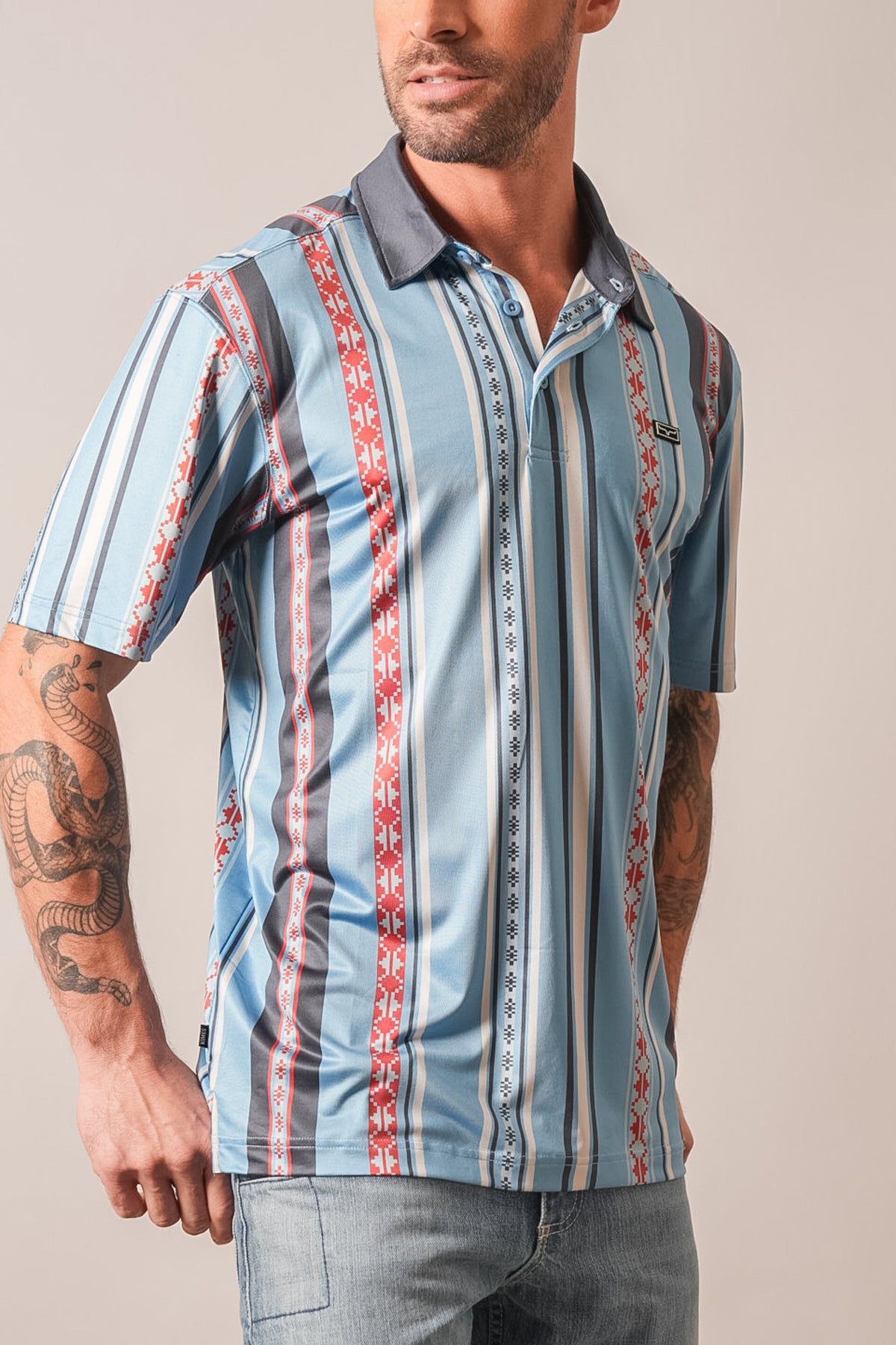 Kimes Ranch Evans polo in mid blue with red, white, and black tribal vertical stripes, short sleeves, and two-button placket