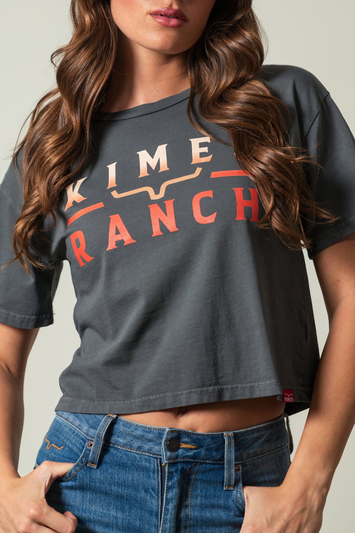 Kimes Ranch Faded Brand pepper crop tee with orange KIME RANCH front print and longhorn mark