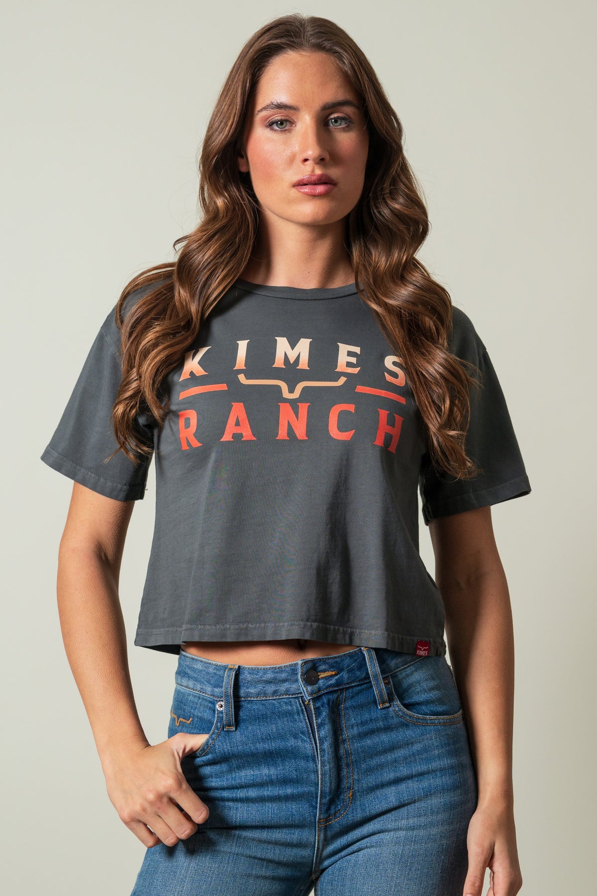 Kimes Ranch Faded Brand short sleeve crewneck shirt in pepper with KIMES RANCH text graphic in cream and orange