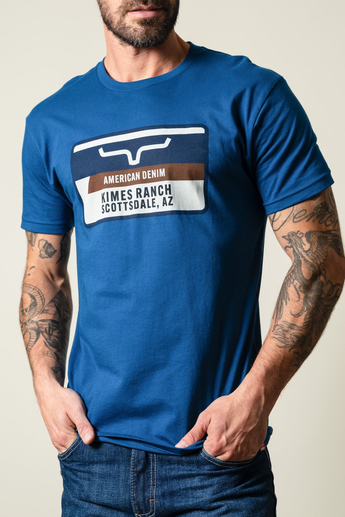 Kimes Ranch Feed Store Cool Blue shirt with graphic print reading AMERICAN DENIM and KIMES RANCH SCOTTSDALE, AZ