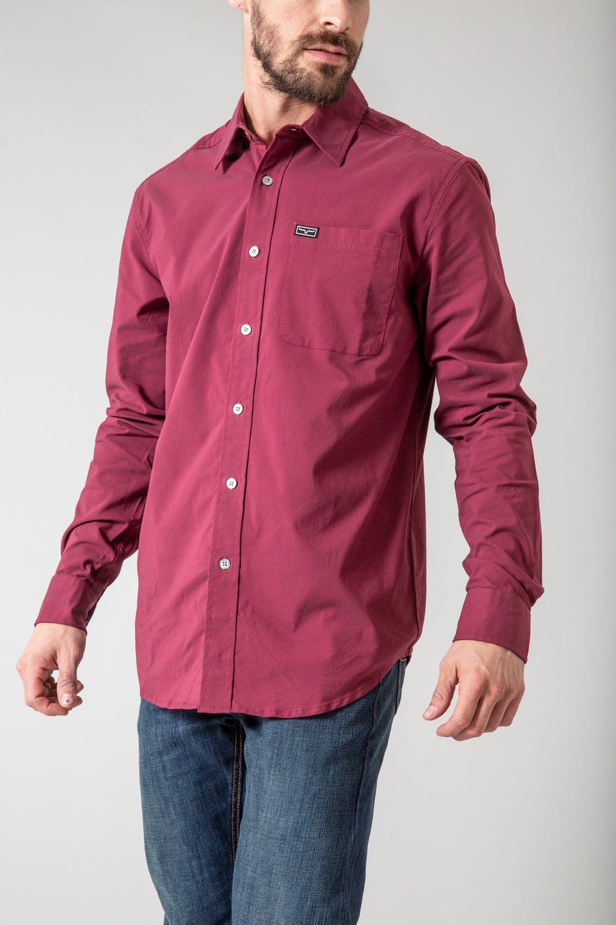 Kimes Ranch Linville Long Sleeve Dress Shirt in Port with a button front and a chest pocket with a logo patch